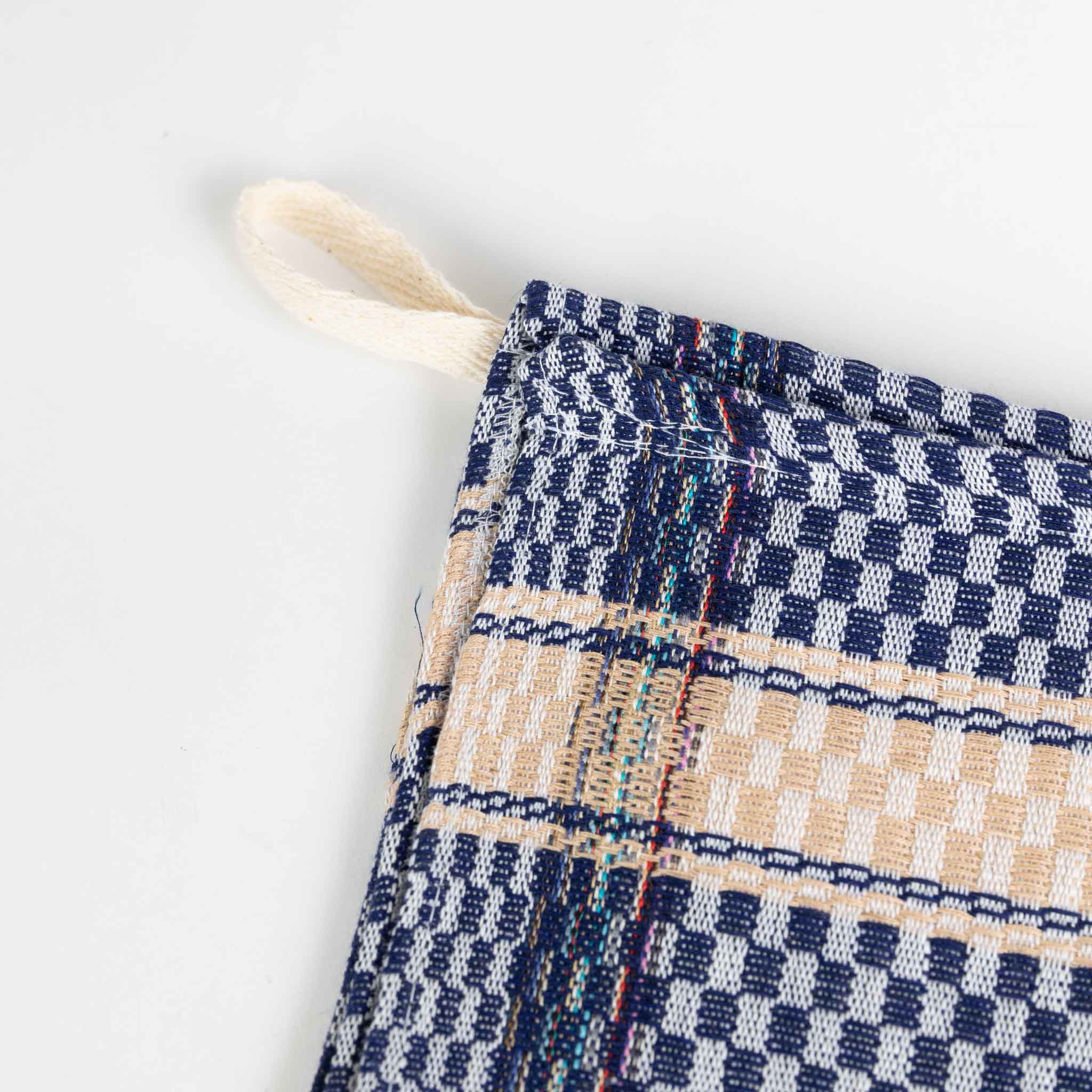 Quick-drying kitchen towel for chefs, draped over a shoulder while cooking, emphasizing its practicality.