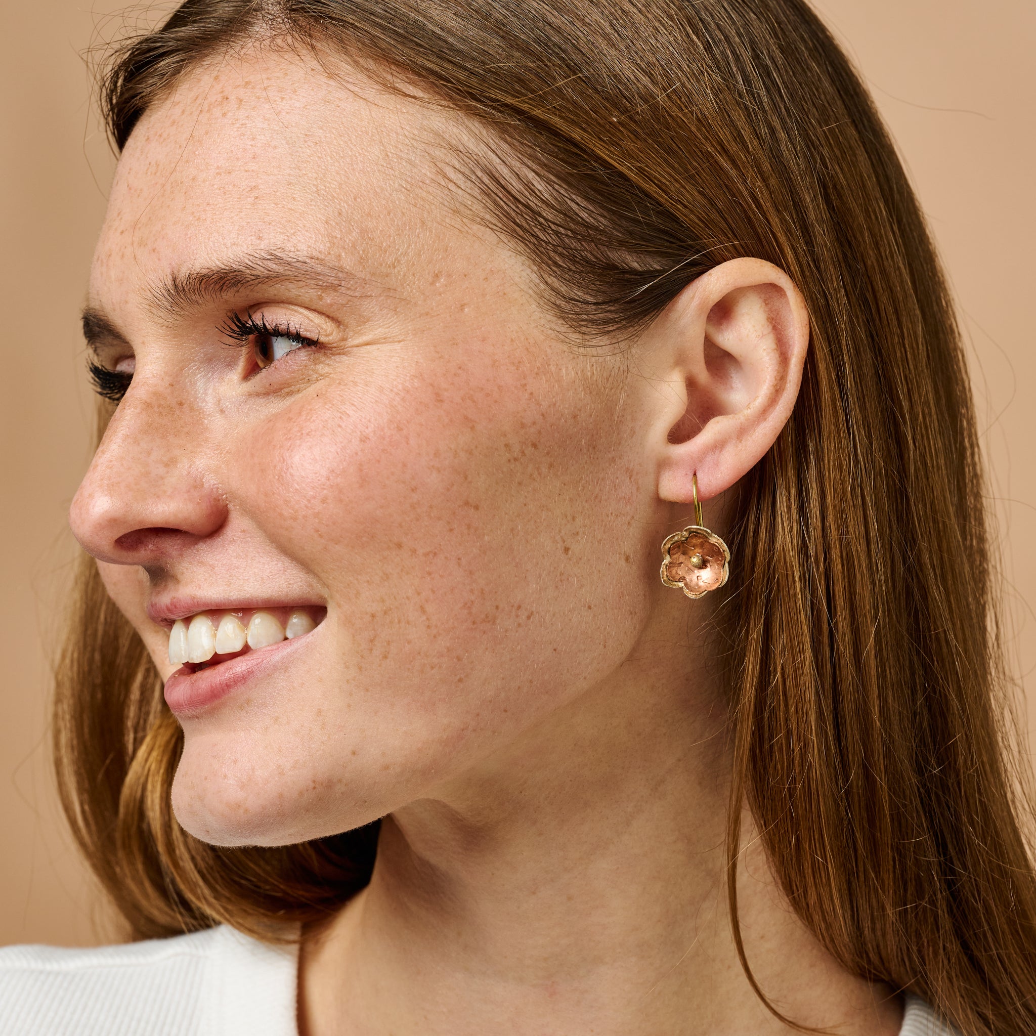 Elegant handmade copper blossom earrings with floral design