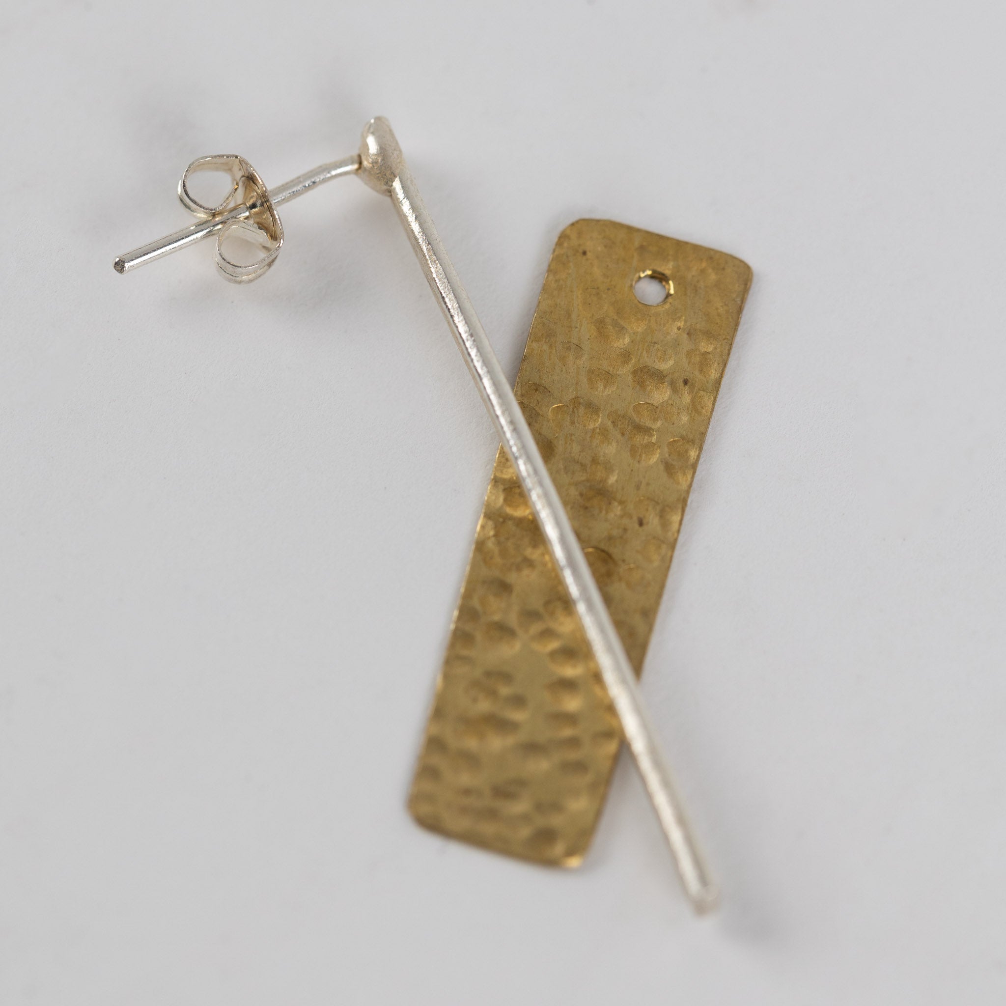 Model wearing the silver brass drop earrings, showcasing their versatility for daily wear.