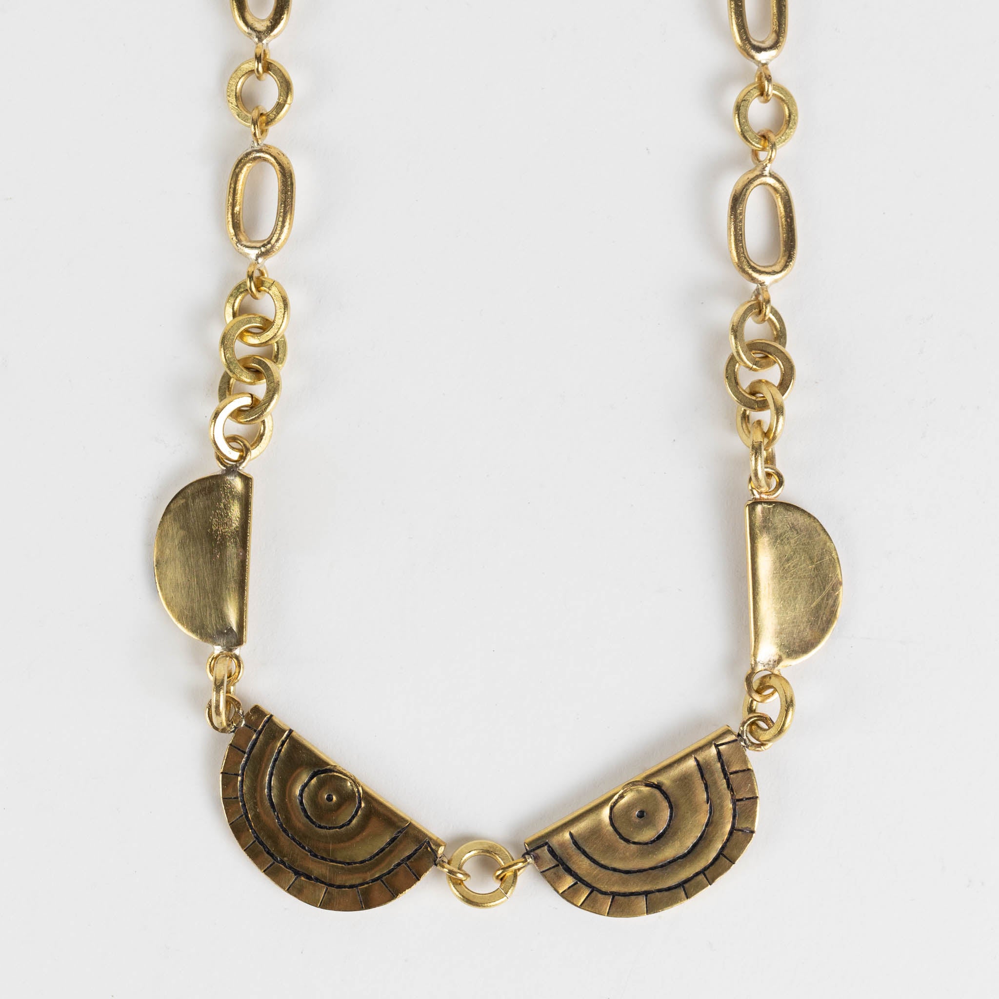Model wearing the unique brass statement necklace for a modern look