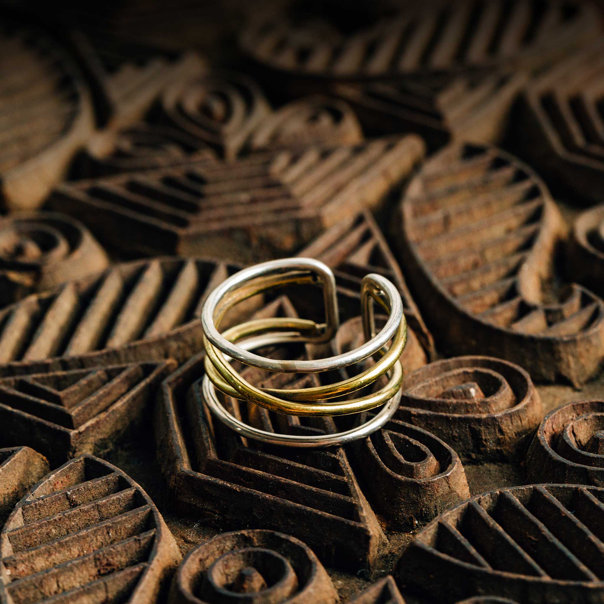 Close-up of the Pathways to Peace Ring showcasing its unique brass and silver design.