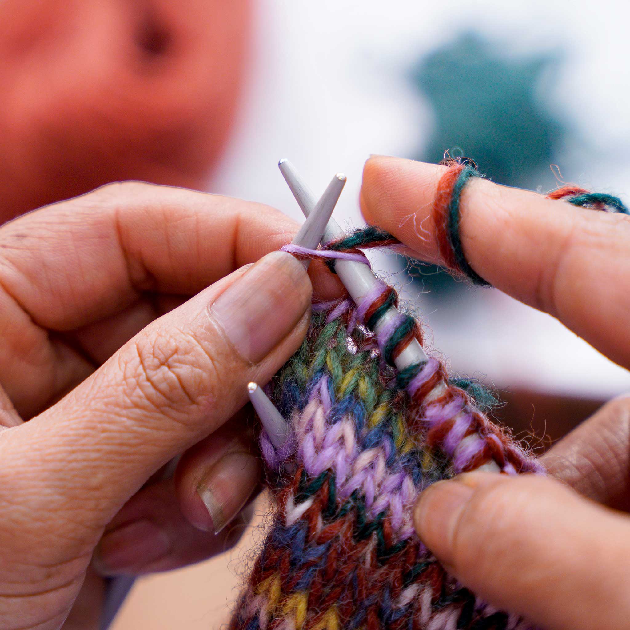 Close-up of the intricate knit pattern of the wool mittens, emphasizing quality and warmth.