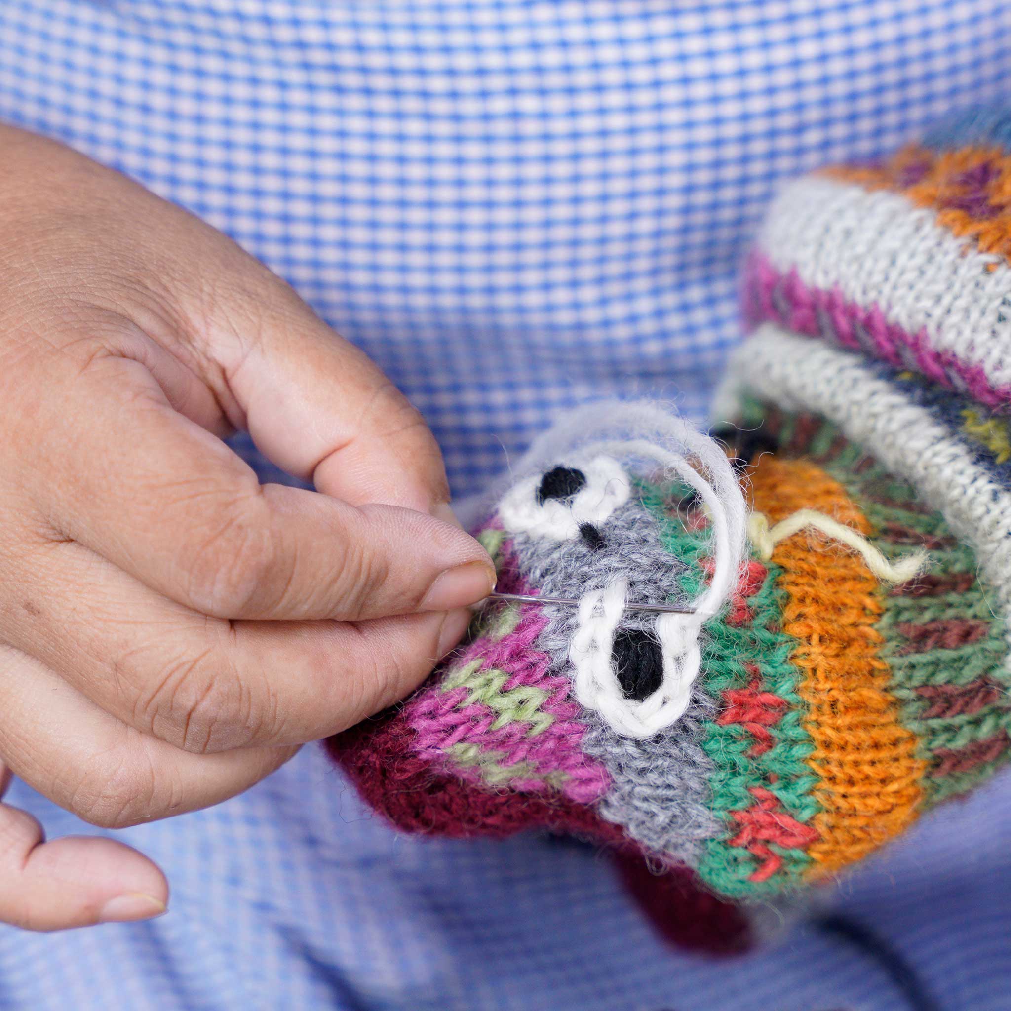 Child playing with the Eco-Friendly Sock Puppet Monster during a storytelling session, engaging their imagination.