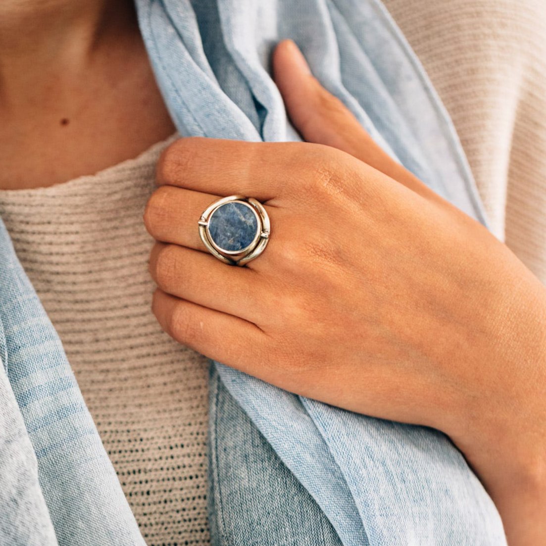 Close-up of the color-changing ring highlighting the unique characteristics of sodalite and serpentine.
