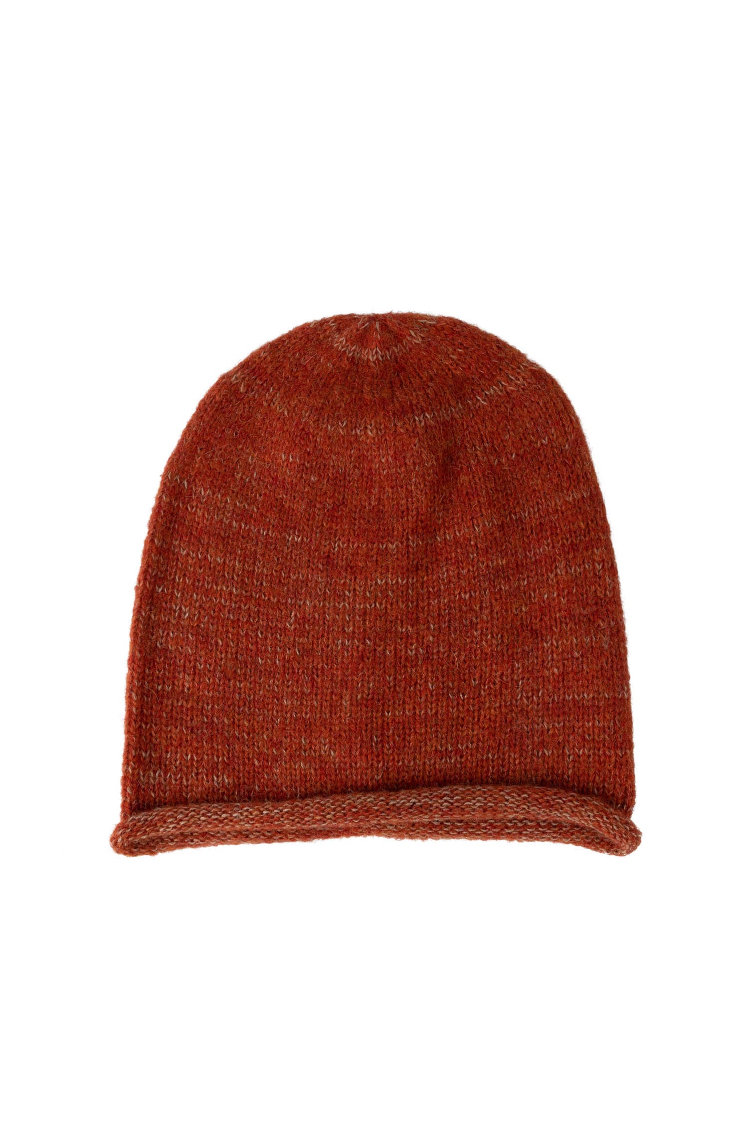 Artisan crafting the alpaca hat, highlighting the handmade quality.
