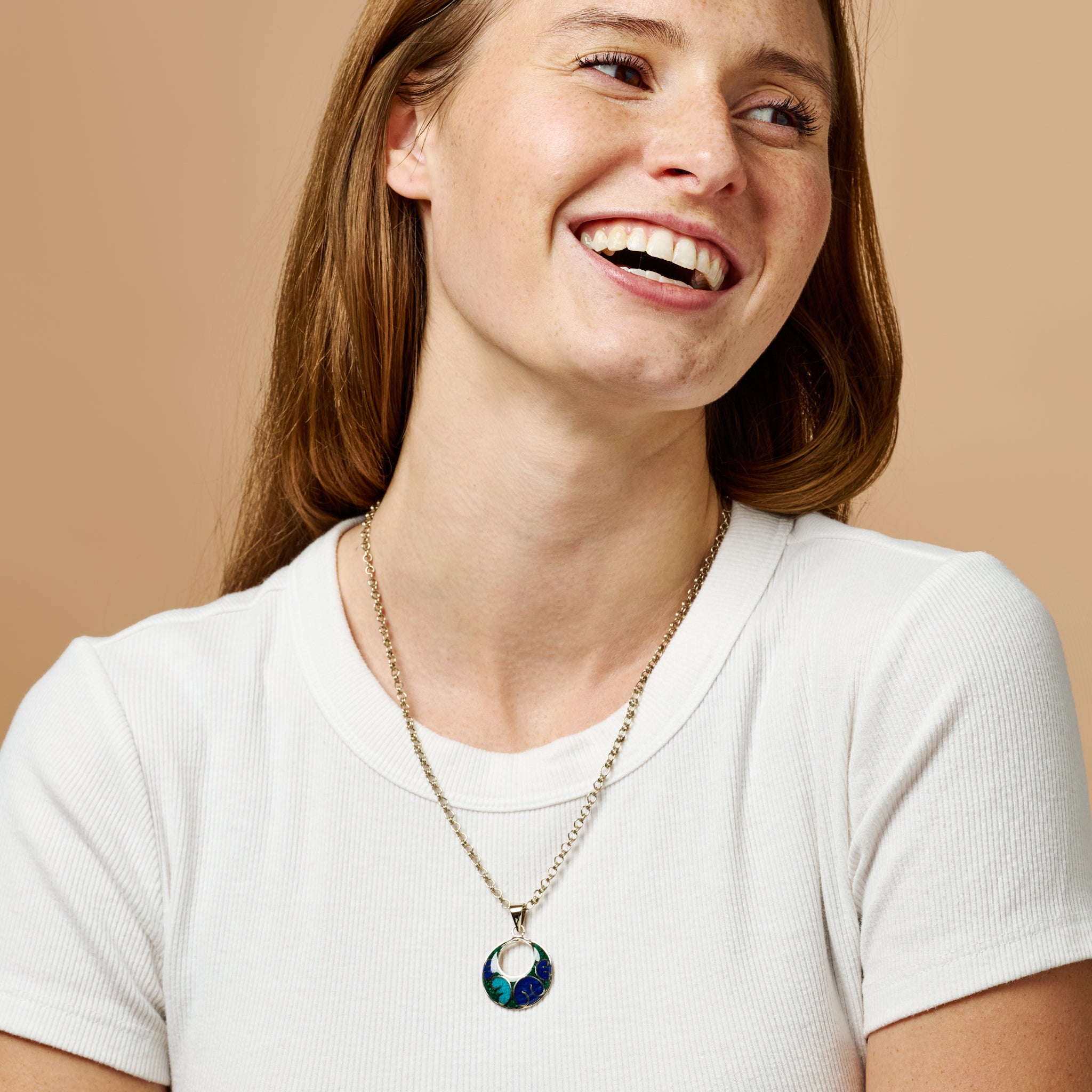 Rear view of the Mosaic Eclipse Necklace highlighting the silver chain and design details