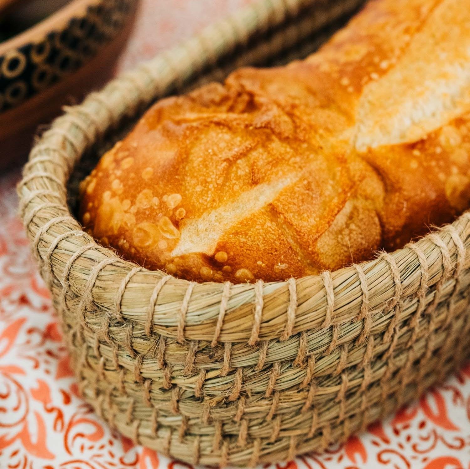 Natural woven bread serving basket with bread warmer insert