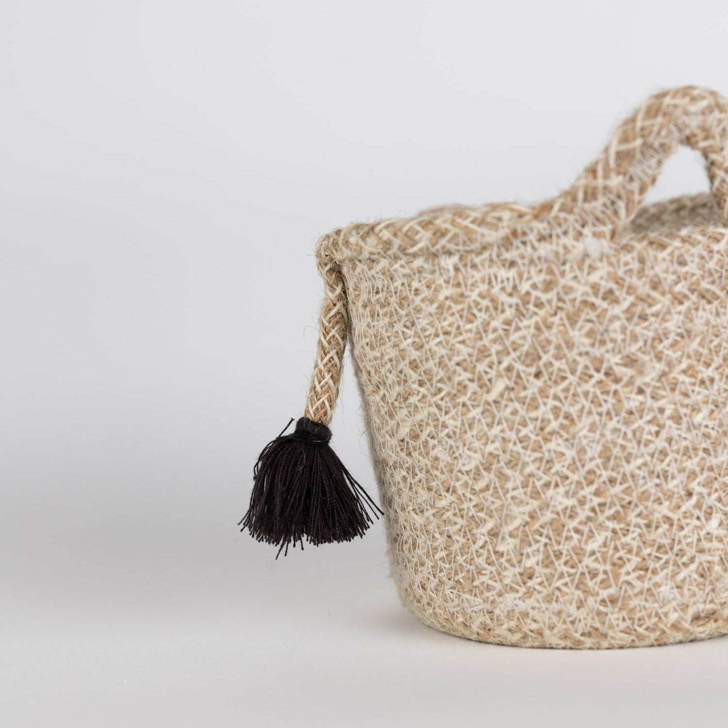 Versatile jute basket filled with toys, showcasing its use as a storage solution for kids rooms.