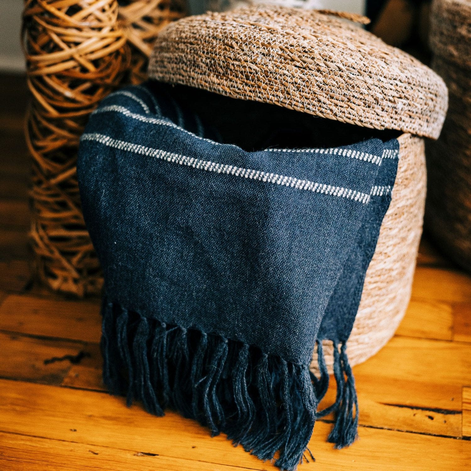 Elegant handwoven Hogla storage basket showcasing intricate weaving and a fitted lid.