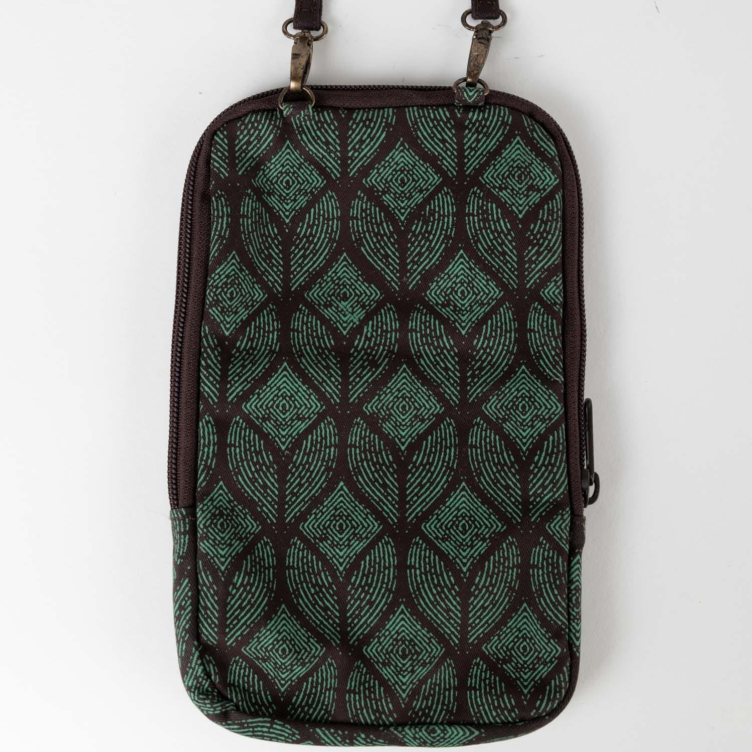 Artisan sewing recycled sari fabric into a stylish festival bag