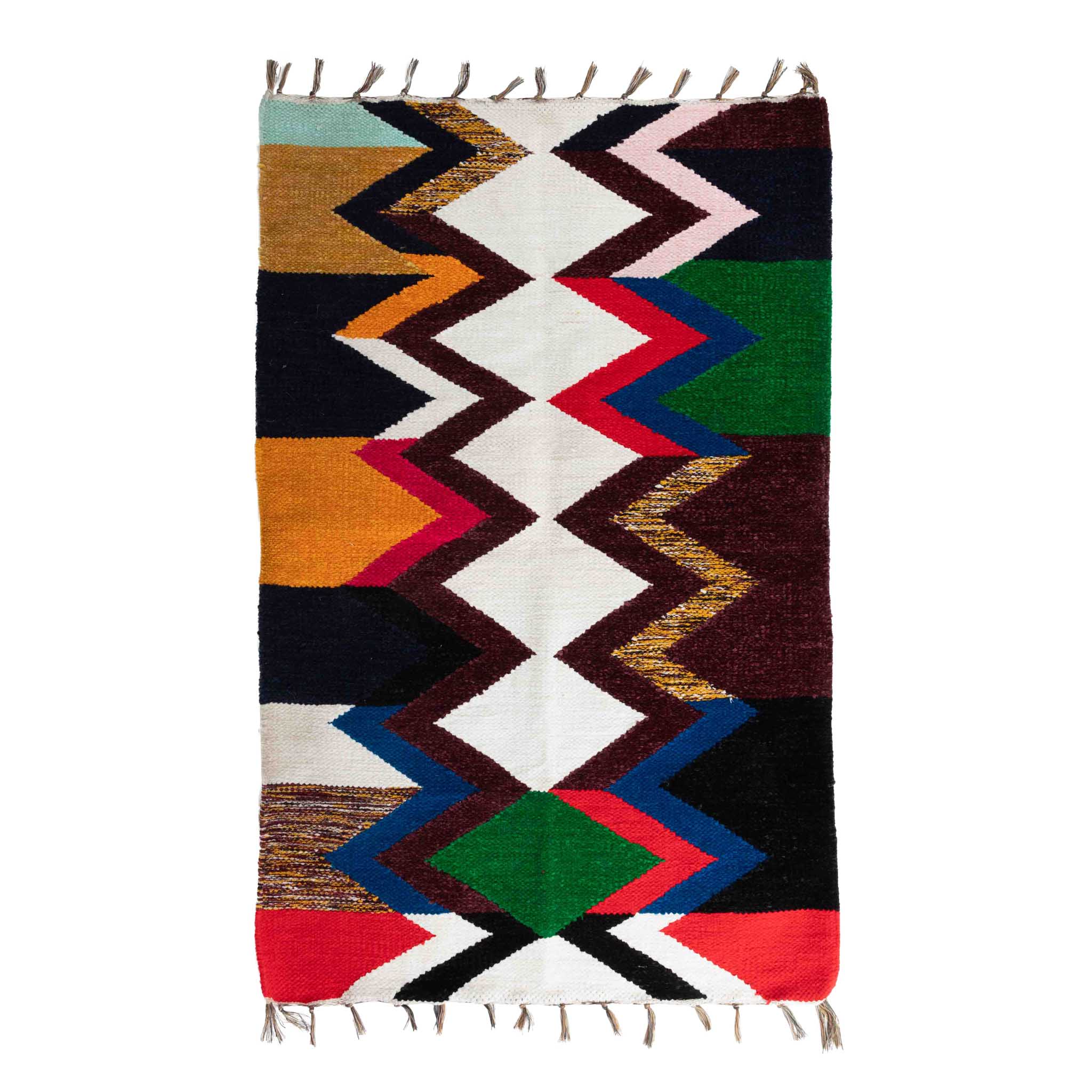 Close-up of handcrafted zig-zag chenille rug with recycled sari fabrics