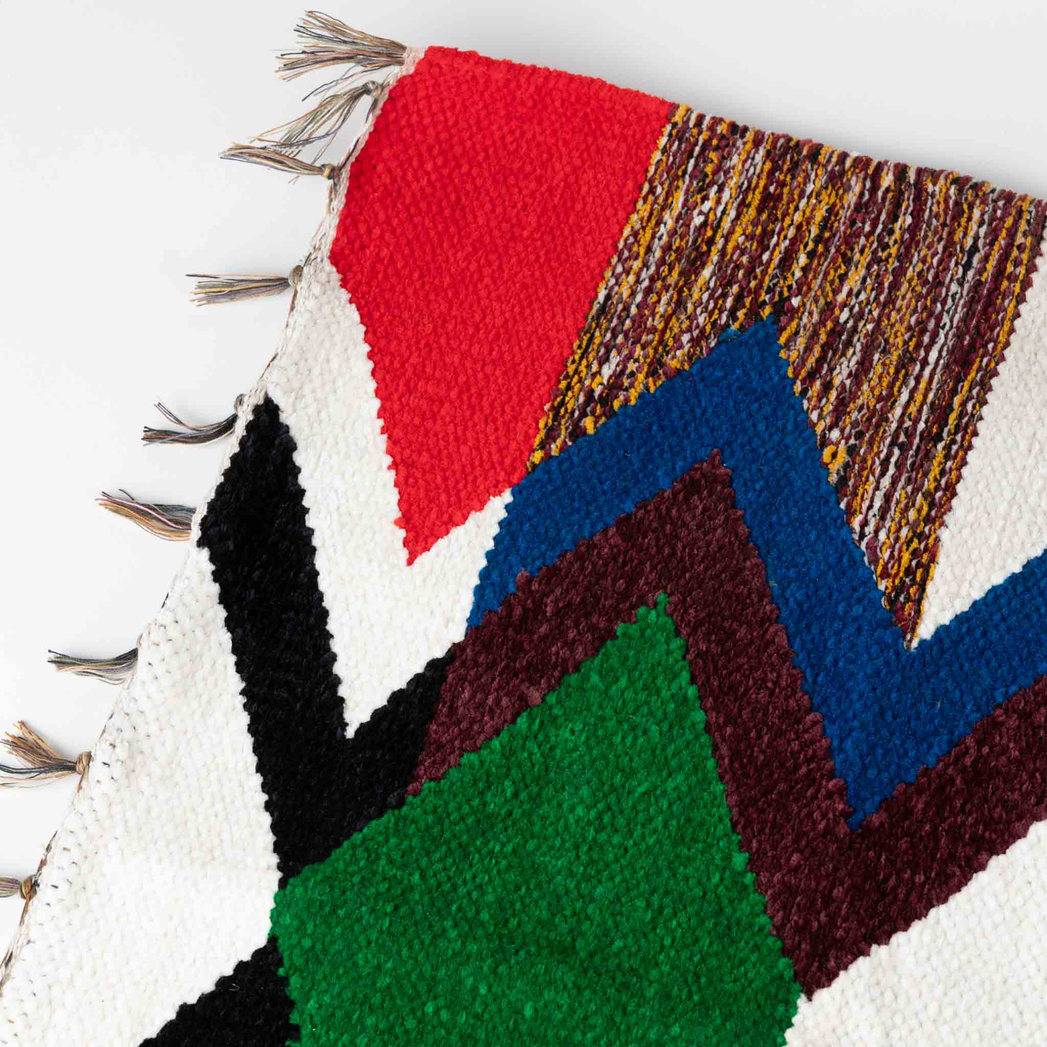Stylish bathroom with eco-friendly chenille rug in vibrant colors