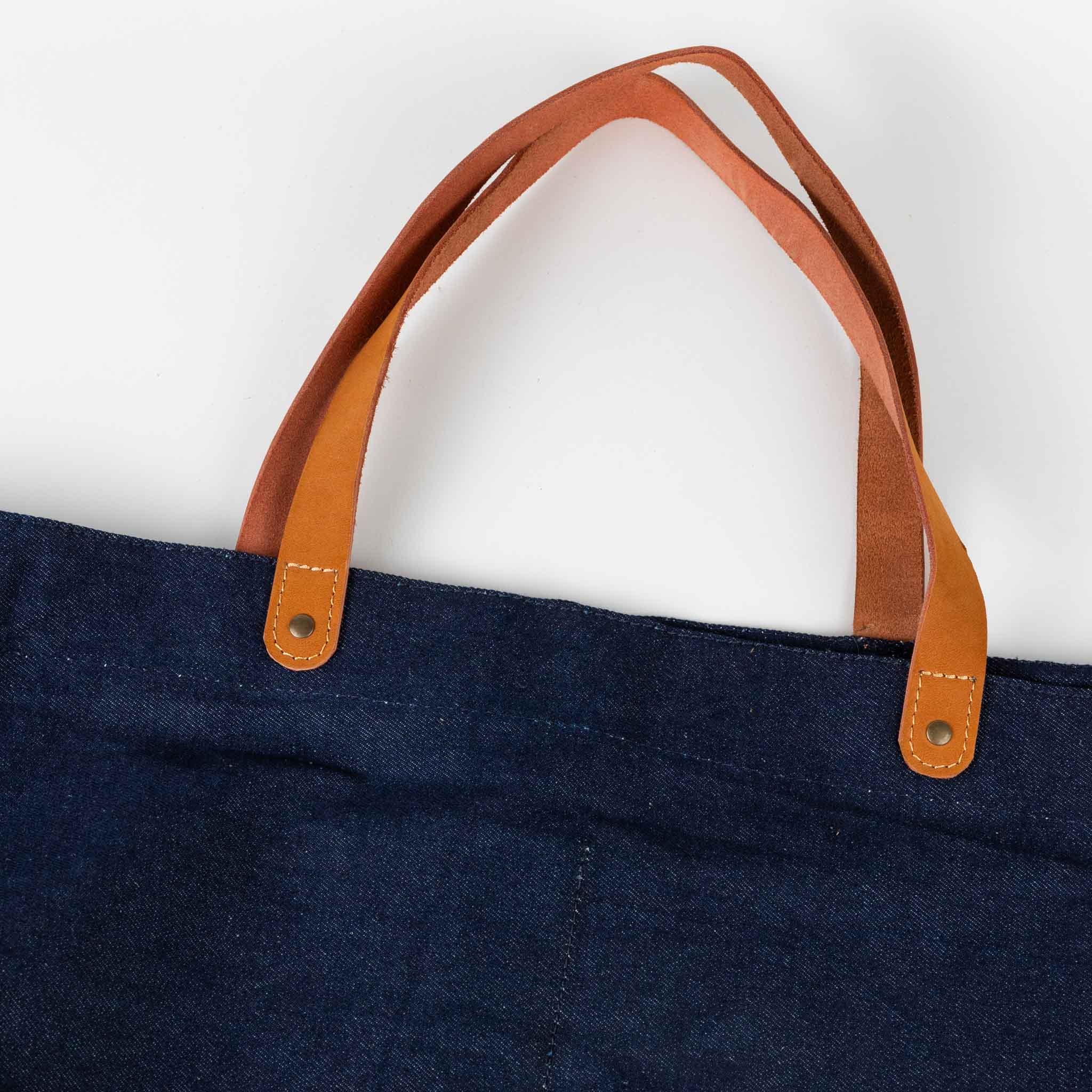 Eco-friendly denim weekender bag packed for a weekend getaway