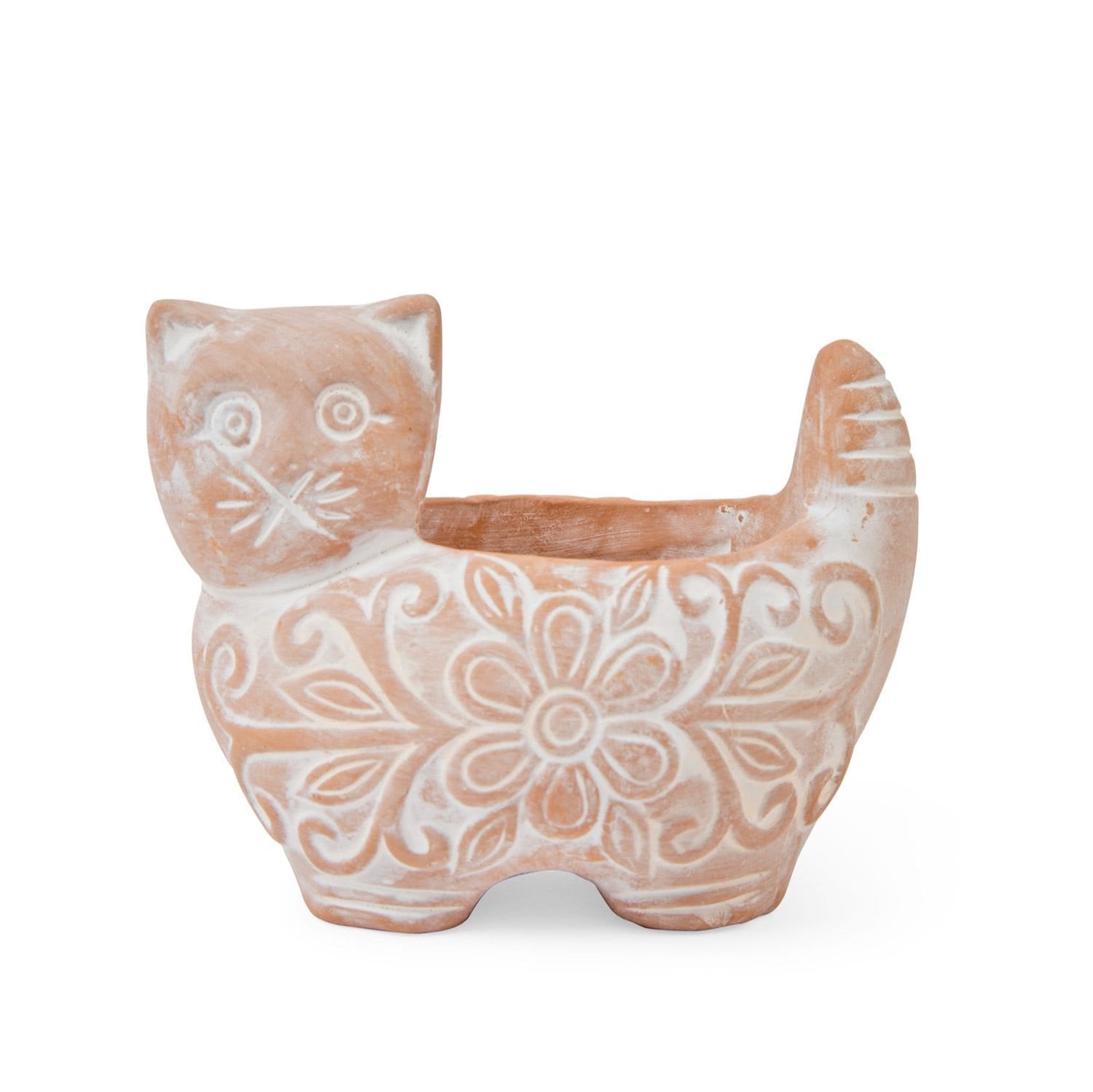 Outdoor garden setup featuring a whimsical ceramic planter for cats.