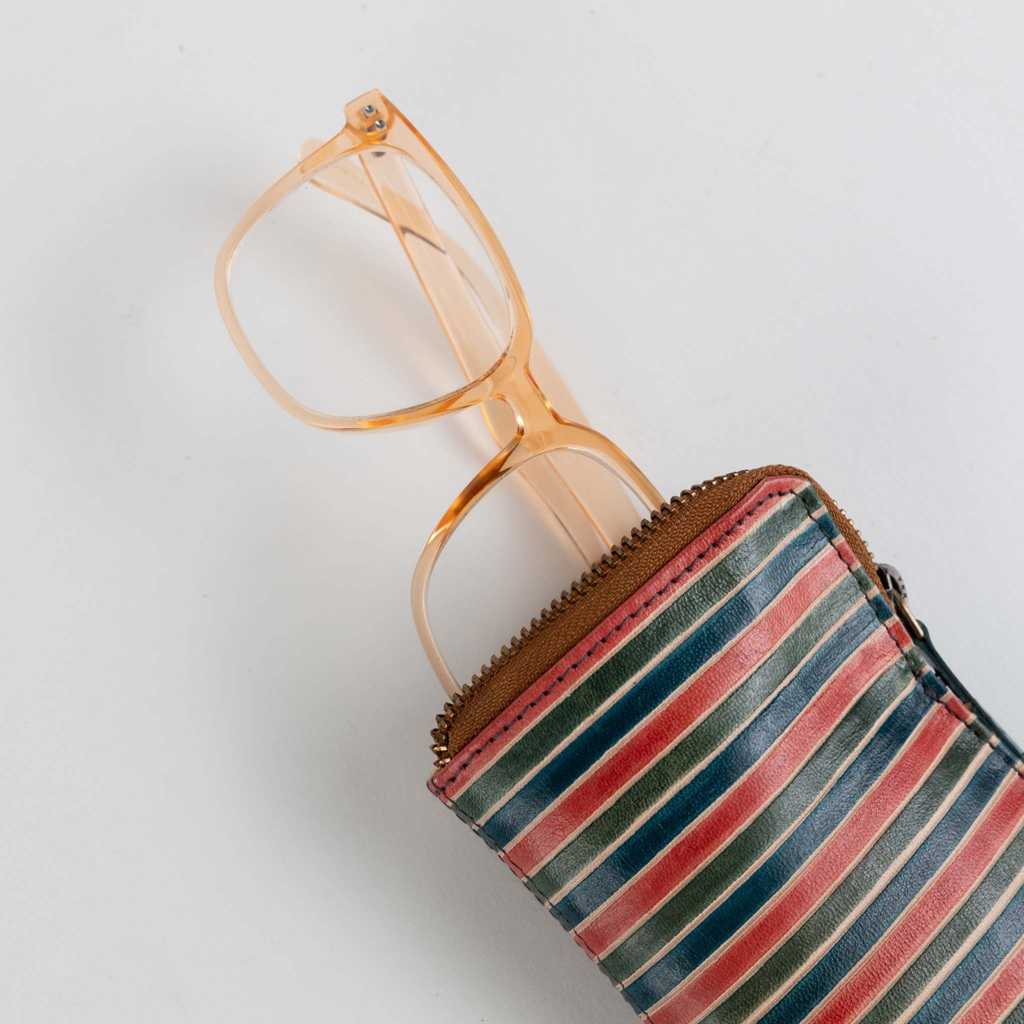 Shanti Luxe Zip Eyewear Holder displayed with sunglasses inside, emphasizing its protective features.