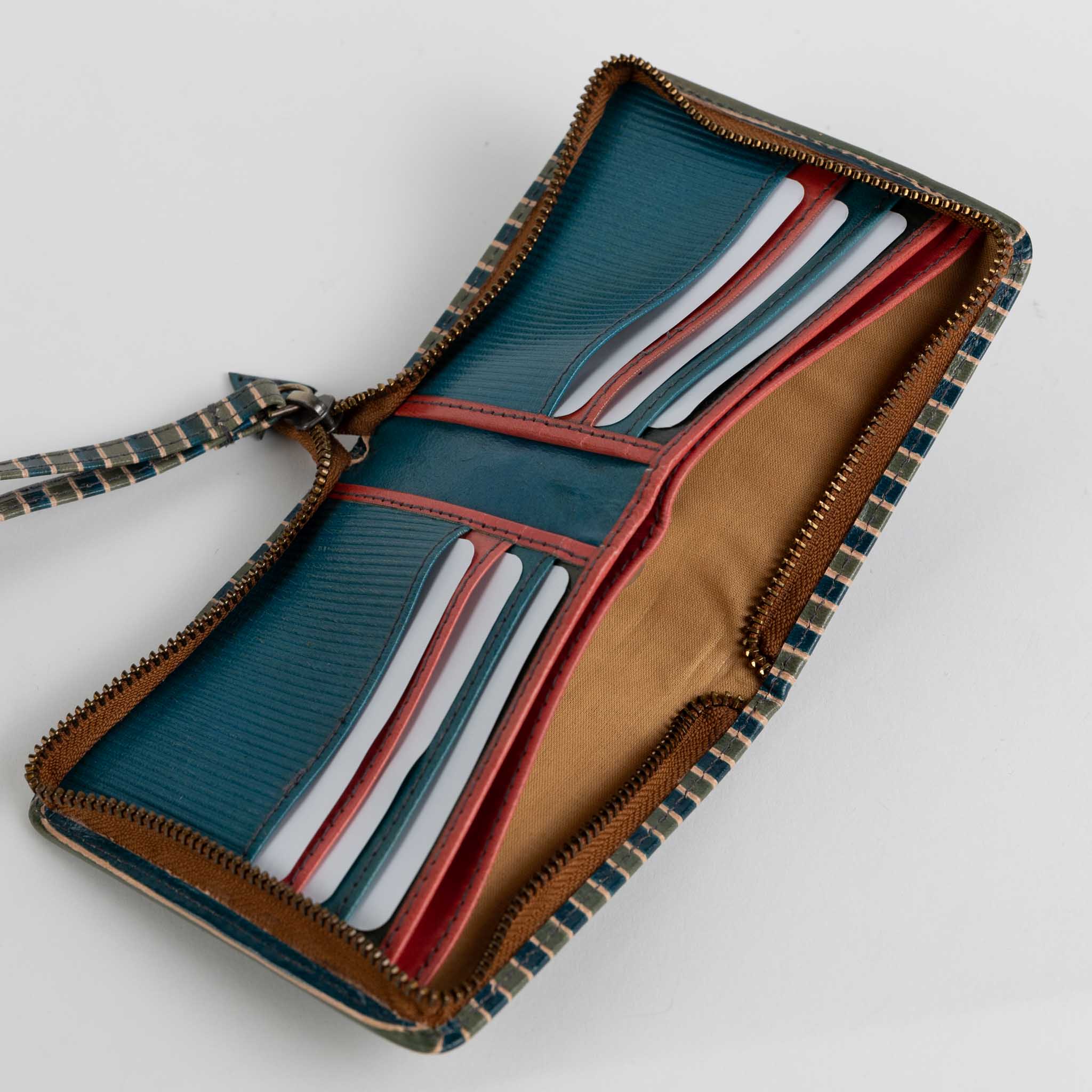 Elegant wrist wallet in use, demonstrating its practicality for everyday outings