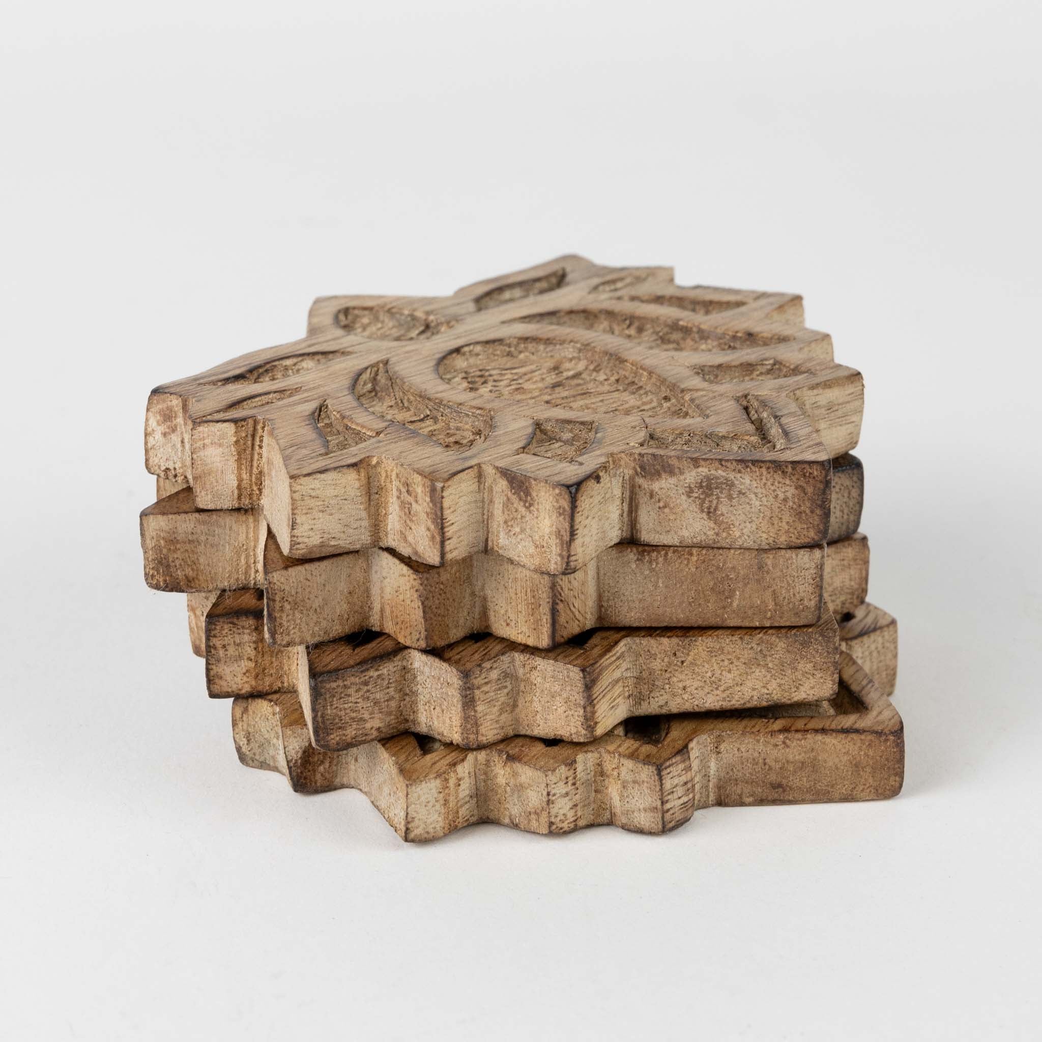 Close-up of handcrafted lotus blossom coaster showcasing detailed carving