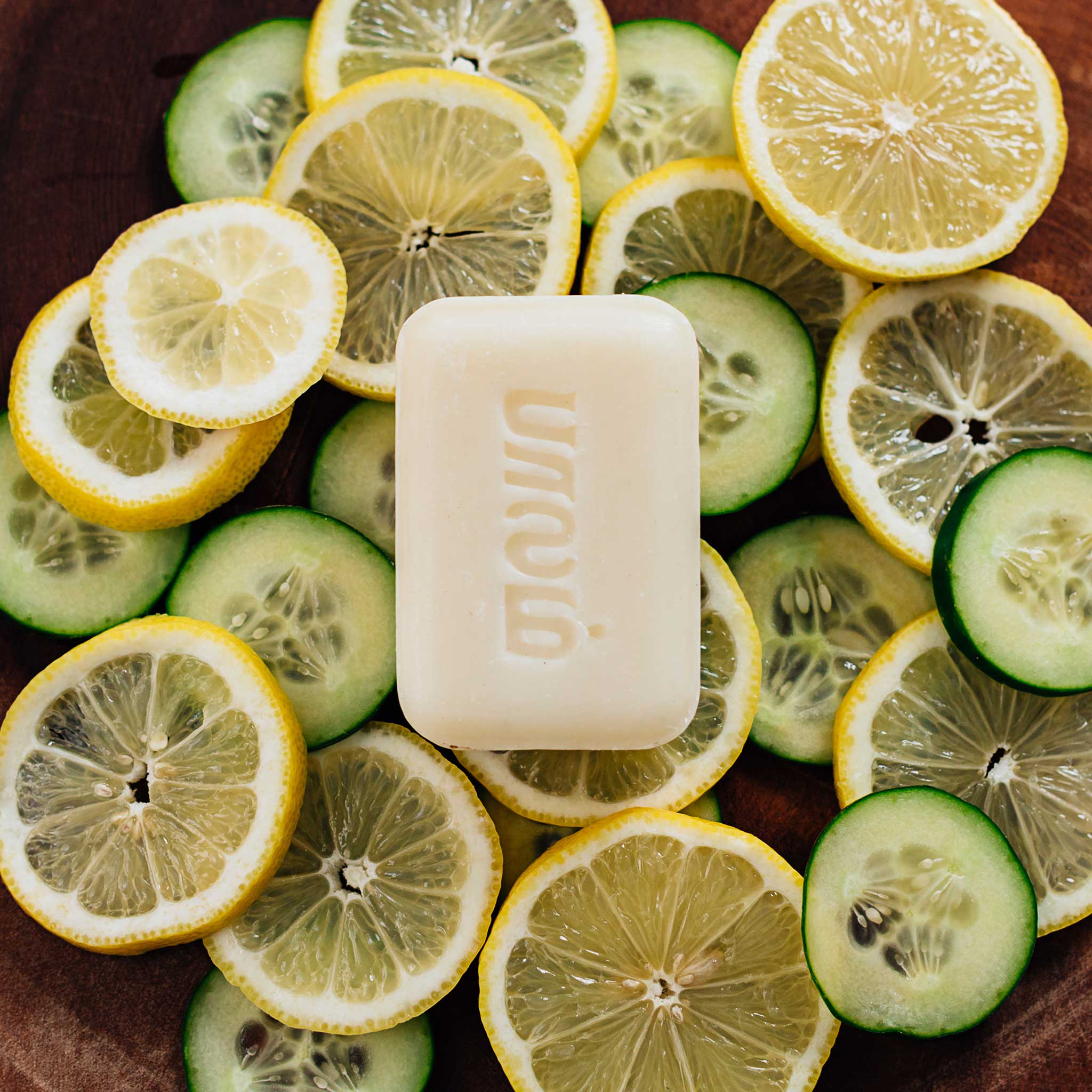 Hand holding Lemon Chefs Soap, demonstrating its gentle, nourishing texture for kitchen cleaning