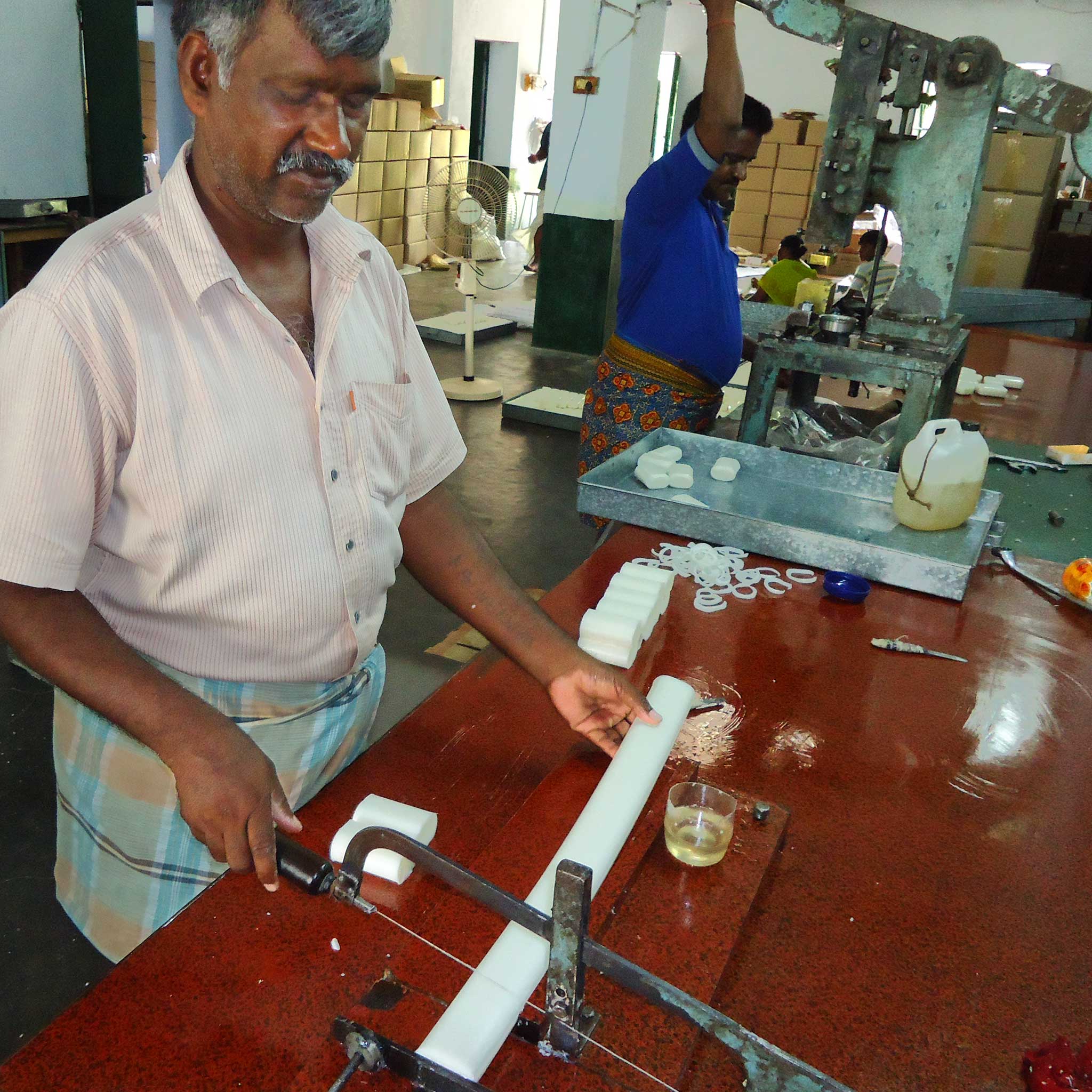 Lathering ginger soap in hand, demonstrating gentle cleansing for sensitive skin