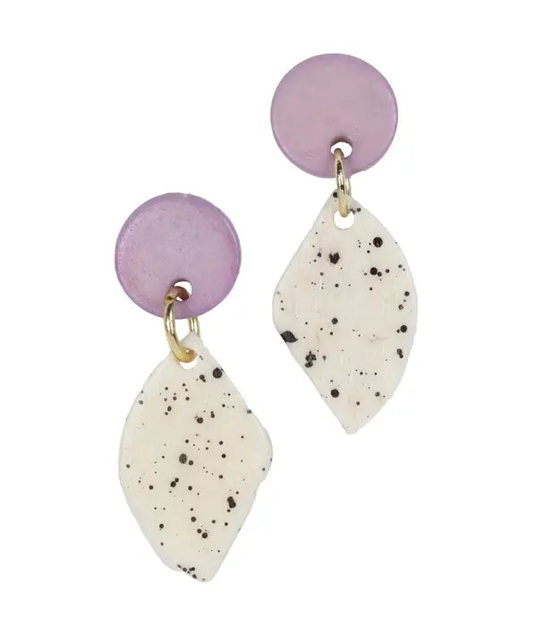 Close-up of purple circle diamond earrings showcasing artisan craftsmanship