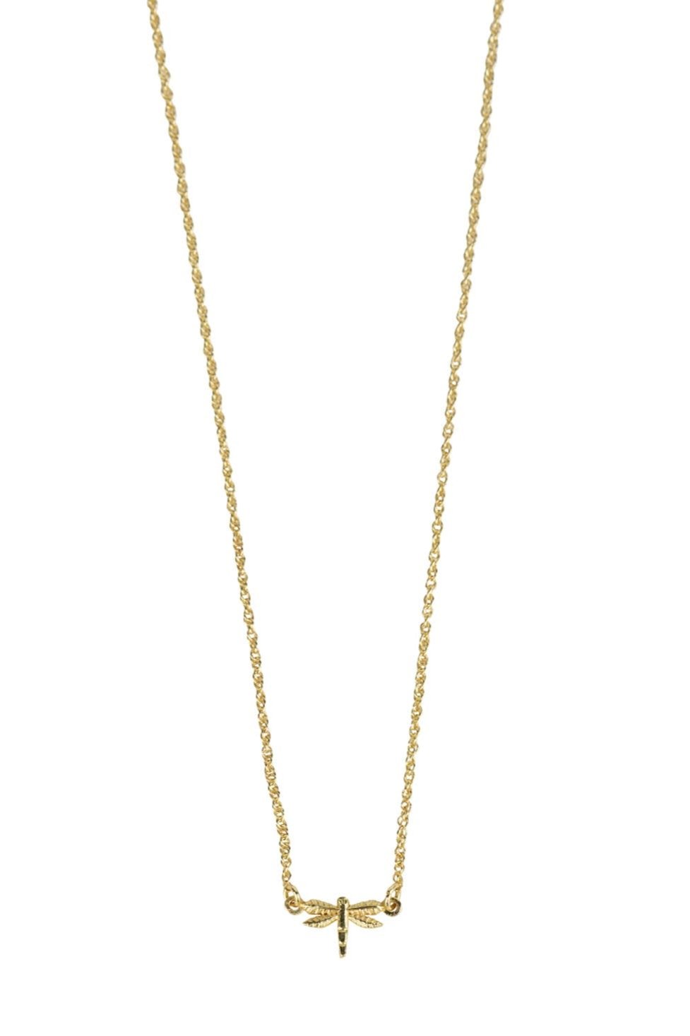 Close-up of handcrafted brass dragonfly pendant necklace on a model