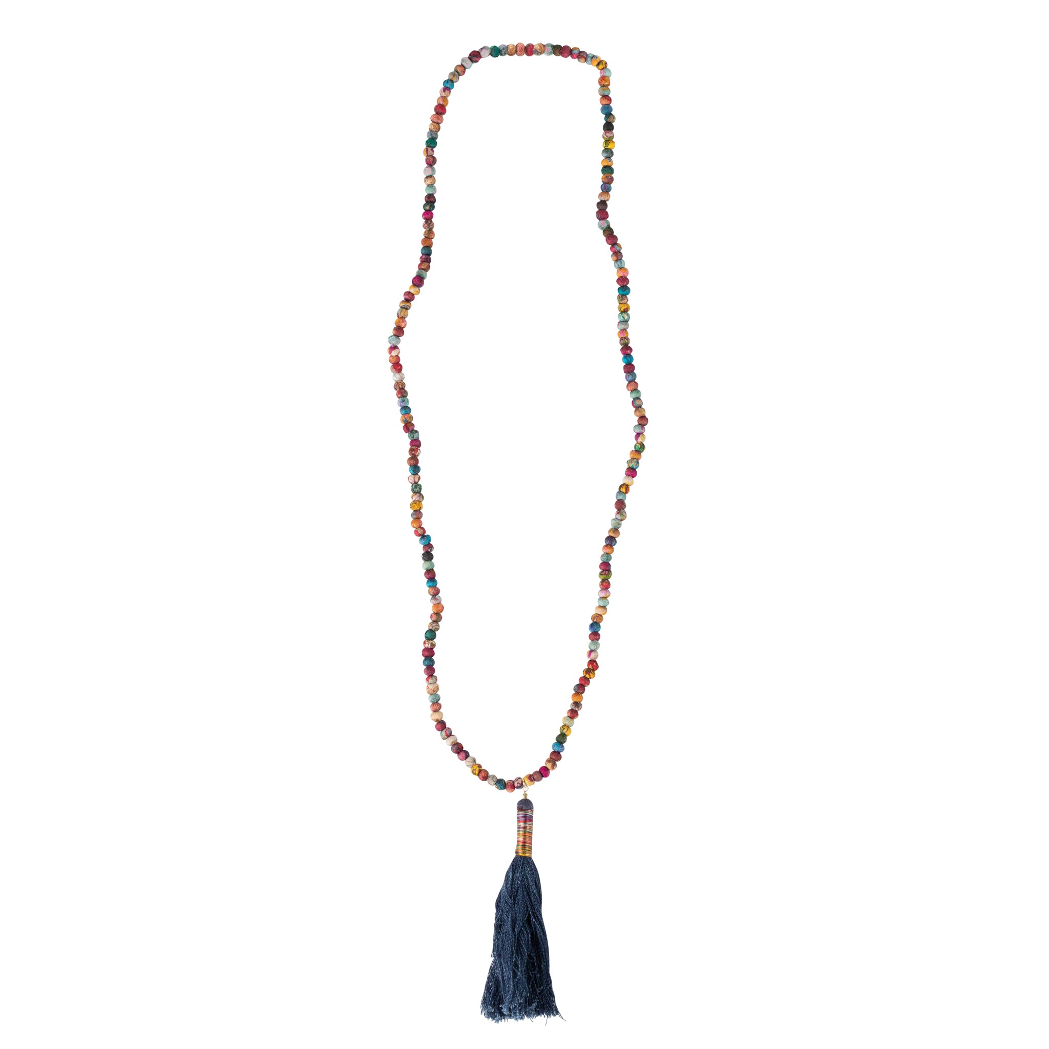 Close-up of the sustainable denim tassel necklace showcasing organic recycled sari beads.