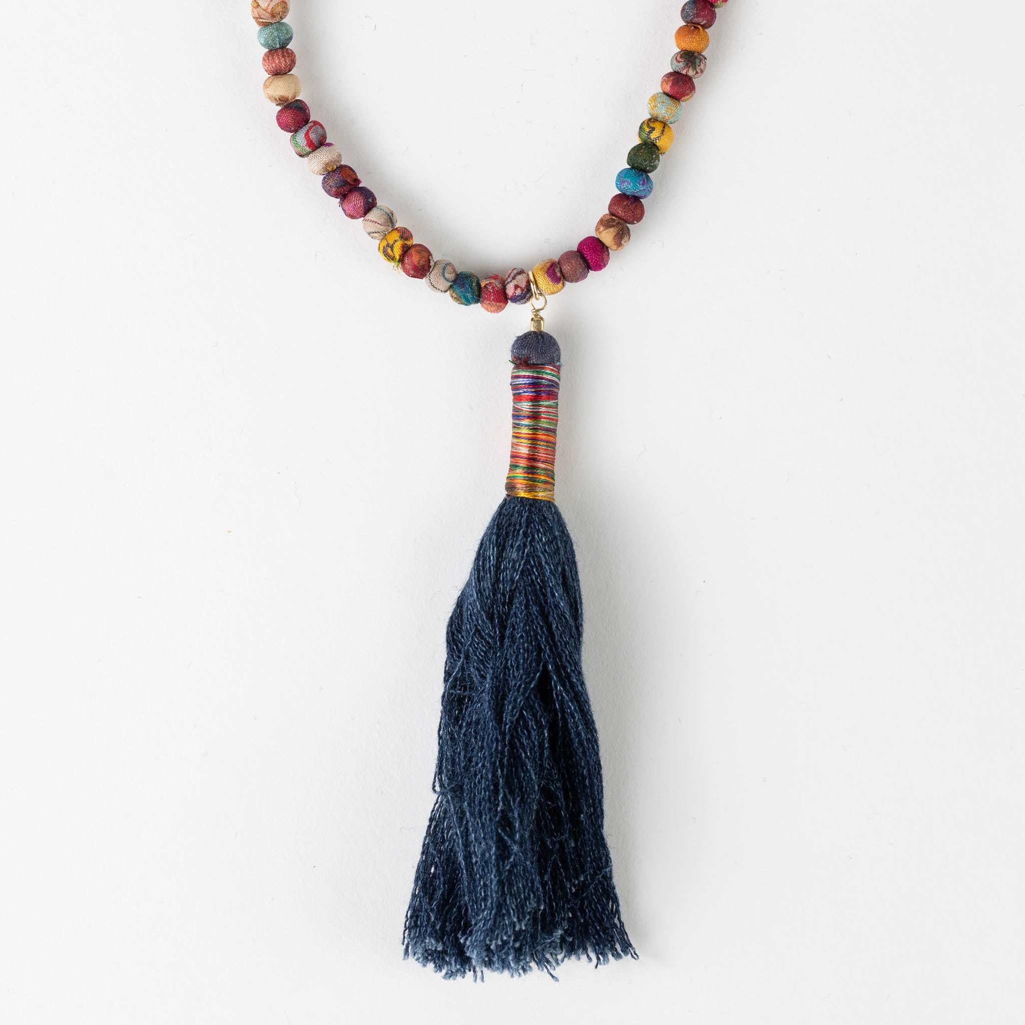 Model wearing the unique handcrafted denim pendant necklace with a boho outfit.