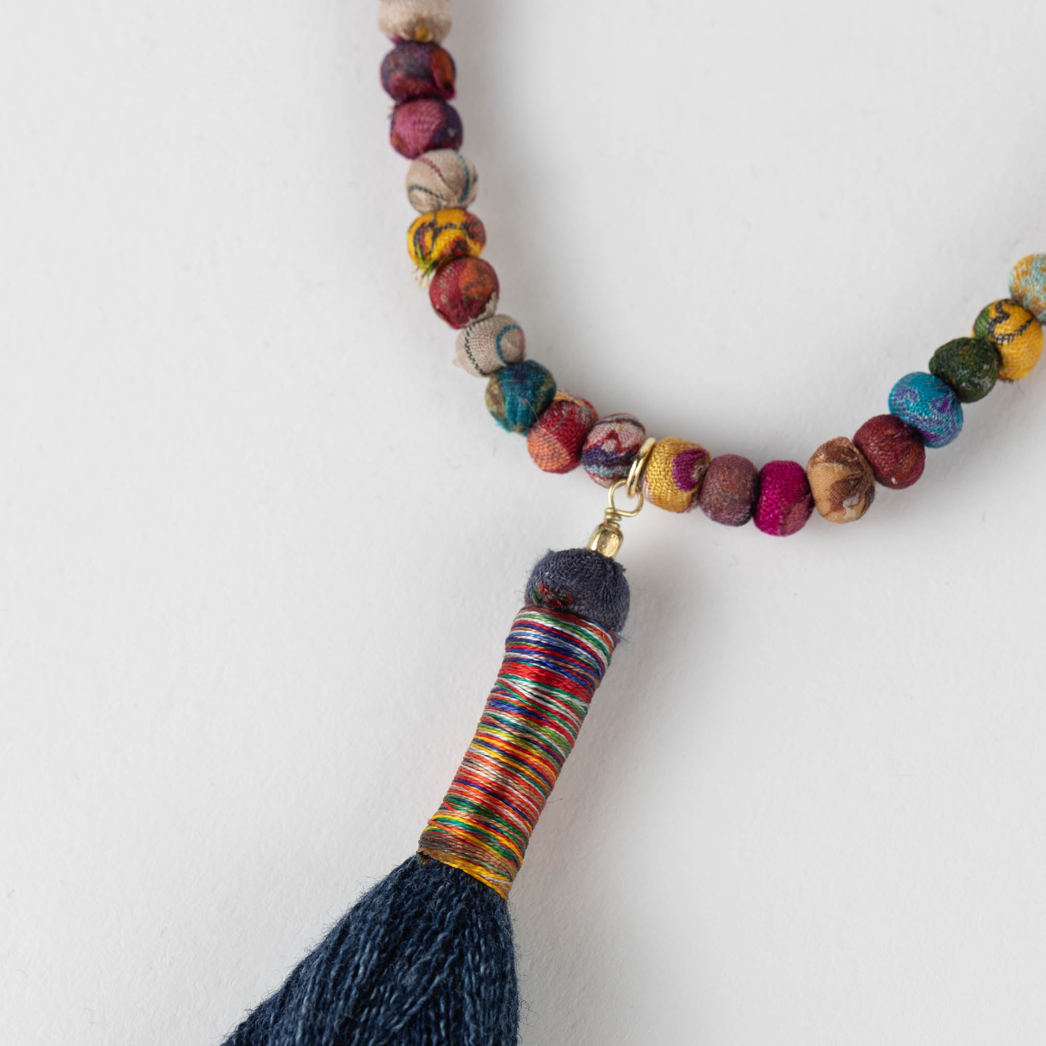Flat lay of the affordable boho tassel jewelry for women on a rustic background.