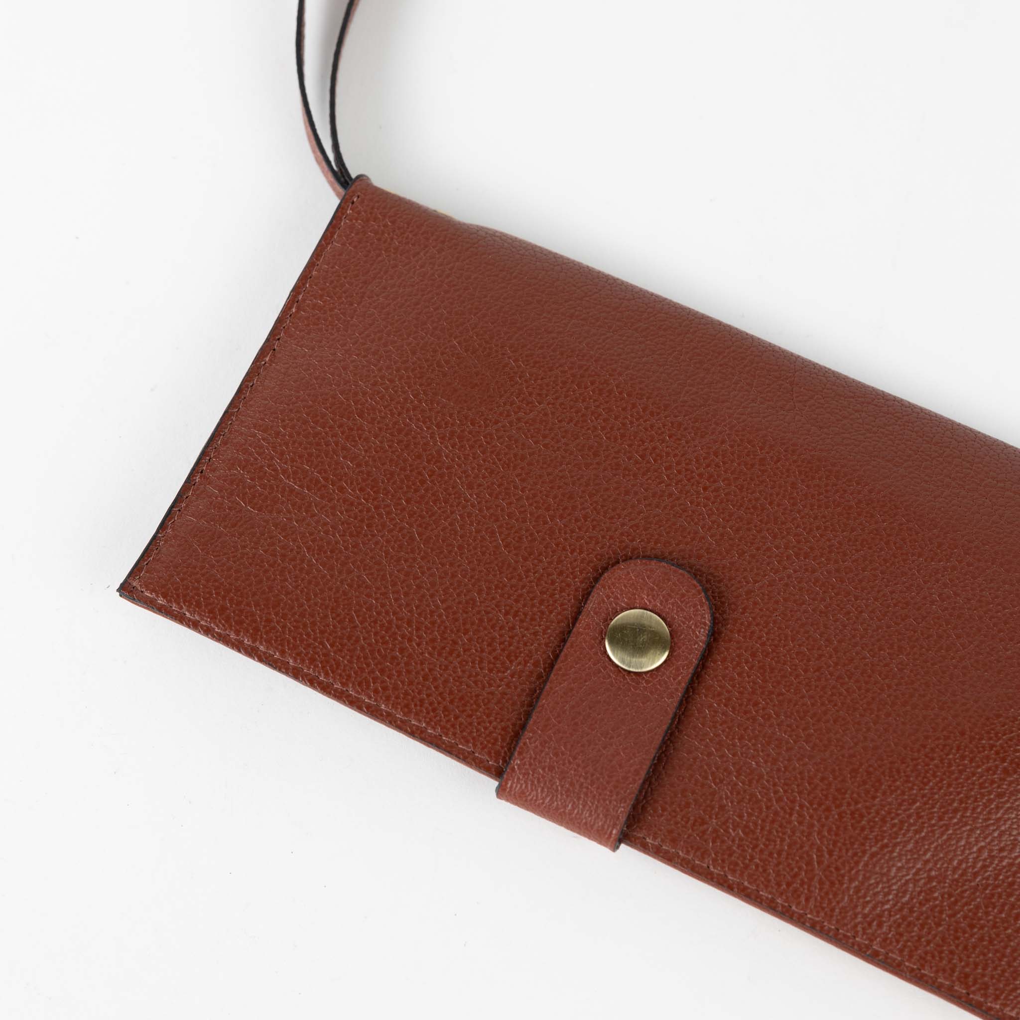 Front view of the reclaimed eco leather wristlet, highlighting its stylish design and card slots.