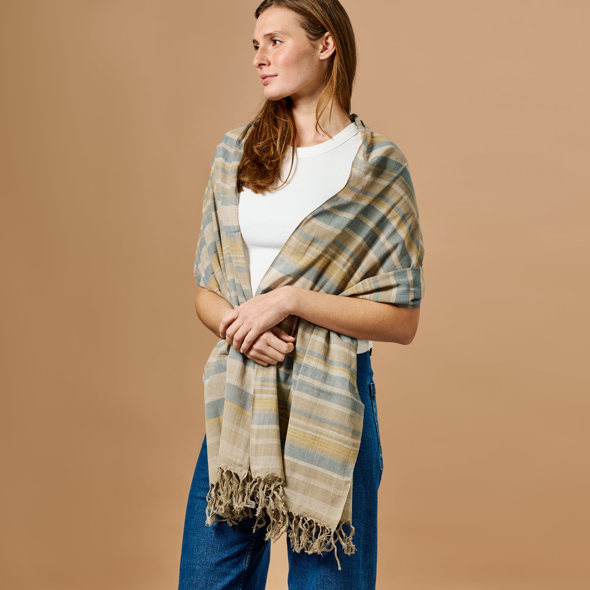 Handcrafted striped cotton scarf with vibrant eco-friendly dyes, perfect for winter styling