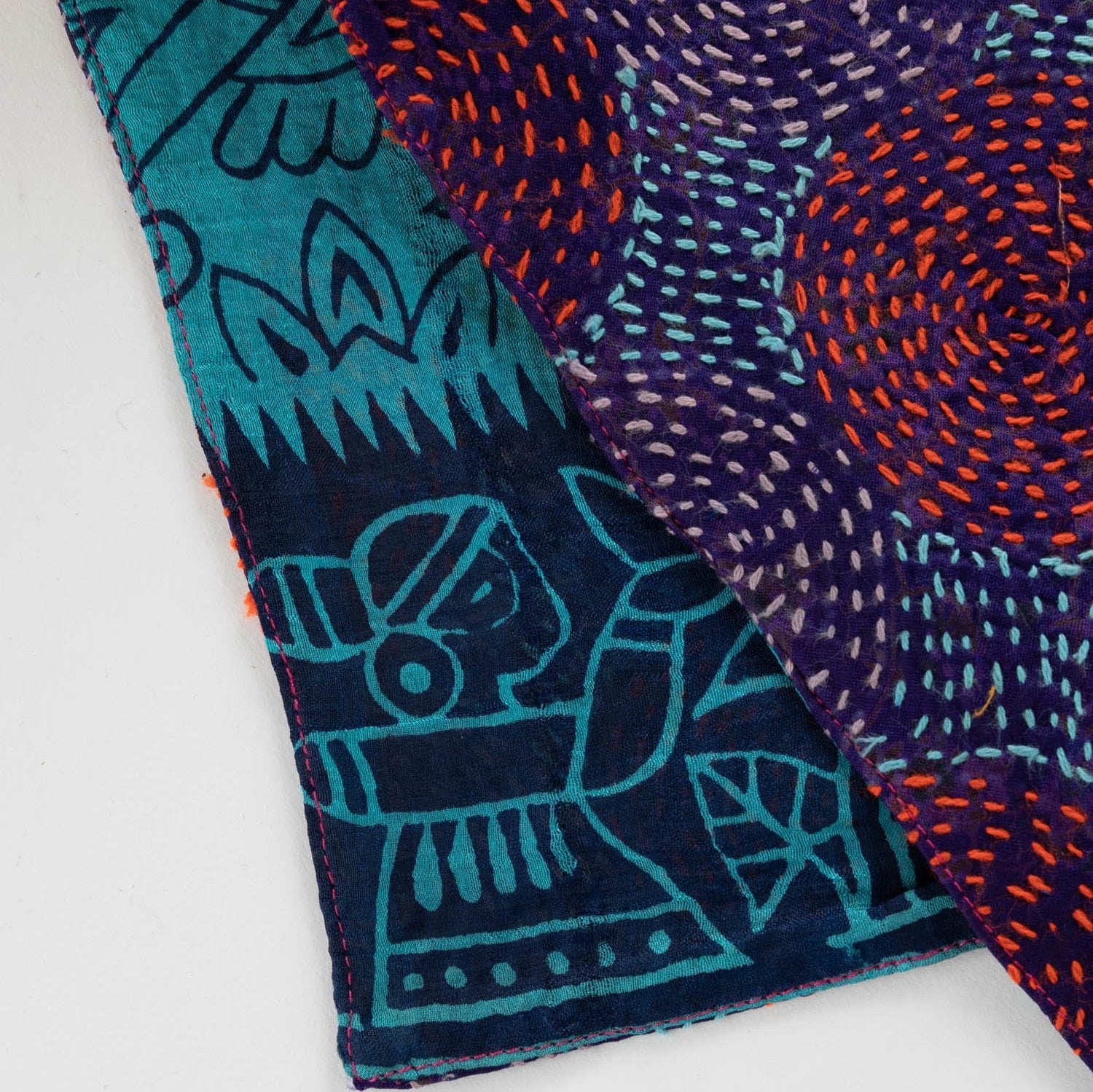 Elegant woman draped in the handmade silk scarf, demonstrating its versatility and style.