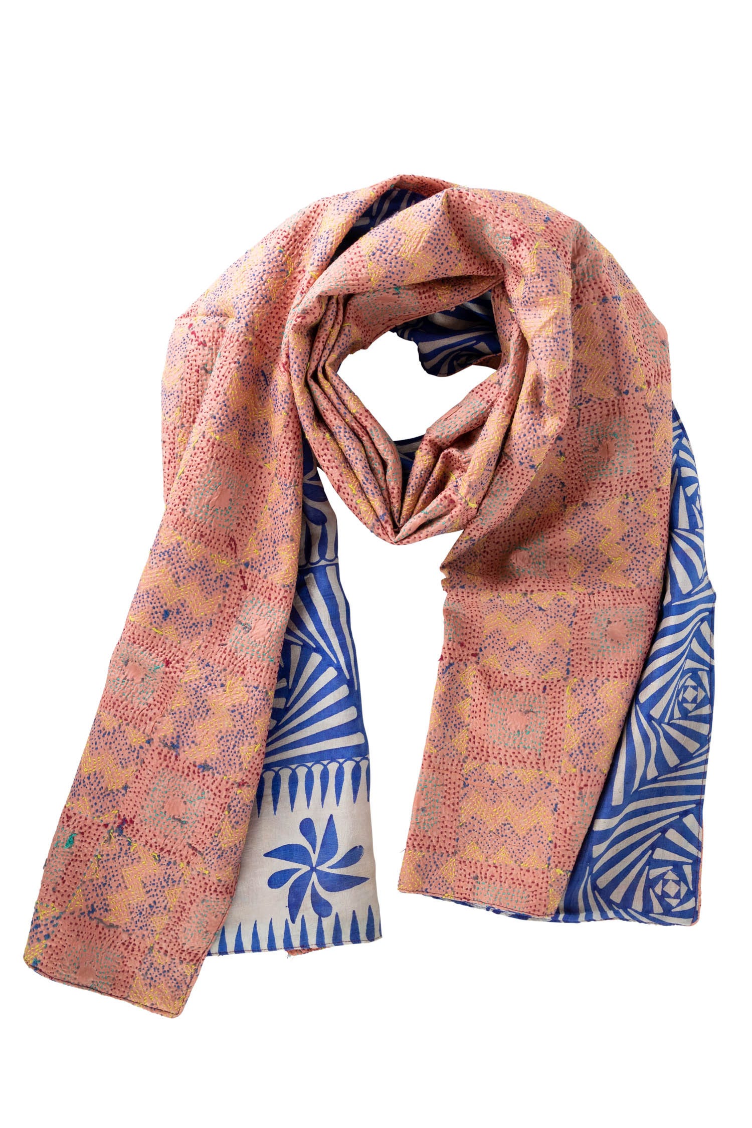 Flat lay of the silk scarf, featuring its vibrant colors and luxurious fabric against a soft background.