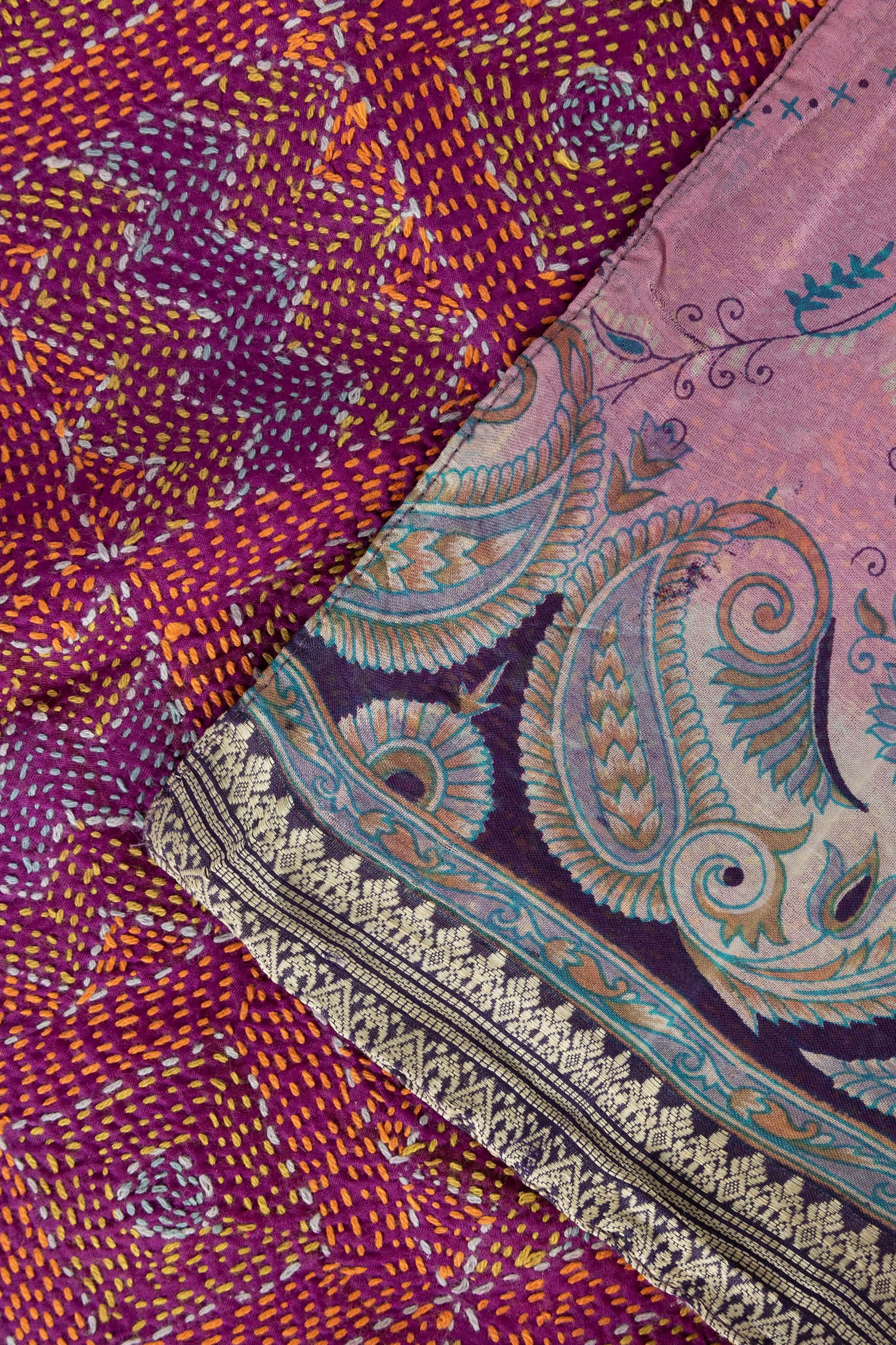 Close-up of the artisan luxury handstitched silk scarf, highlighting its intricate patterns and textures.