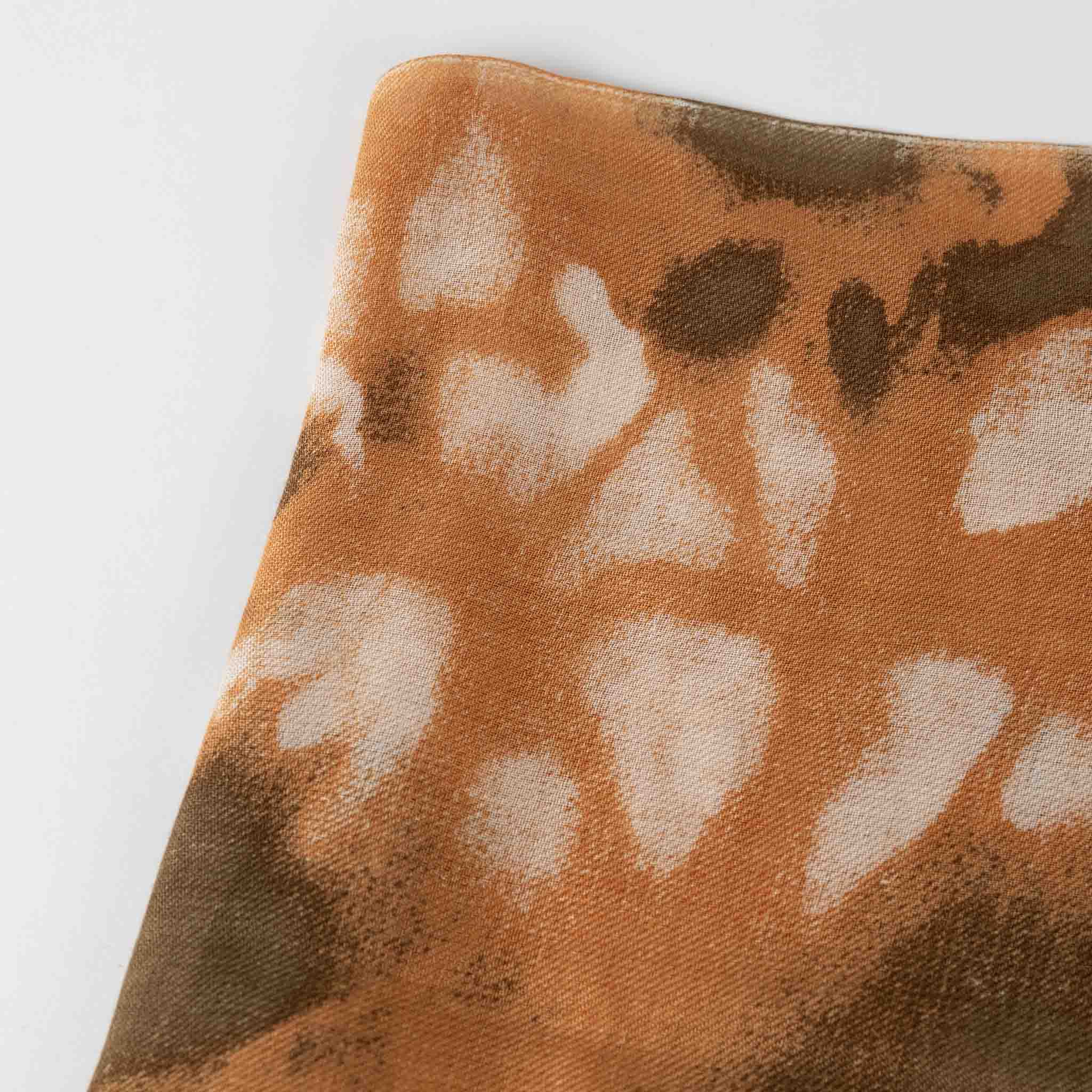 Close-up of a soft, eco-friendly Bengali scarf showing its smooth texture and quality fabric