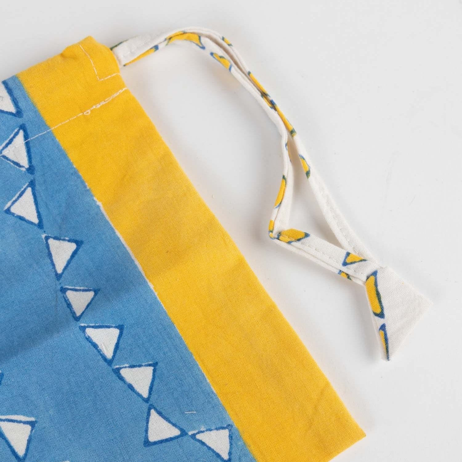 Handmade ditty bag with block print, ideal for organizing shoes or special gifts.