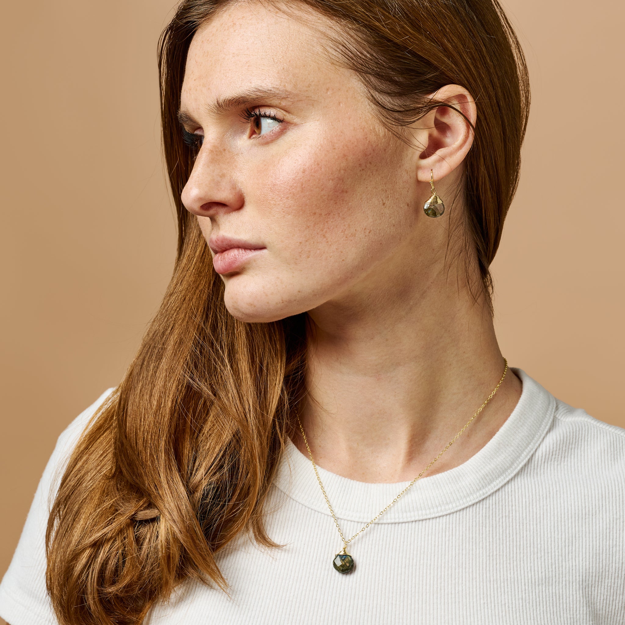 Model wearing labradorite earrings for a casual and elegant look