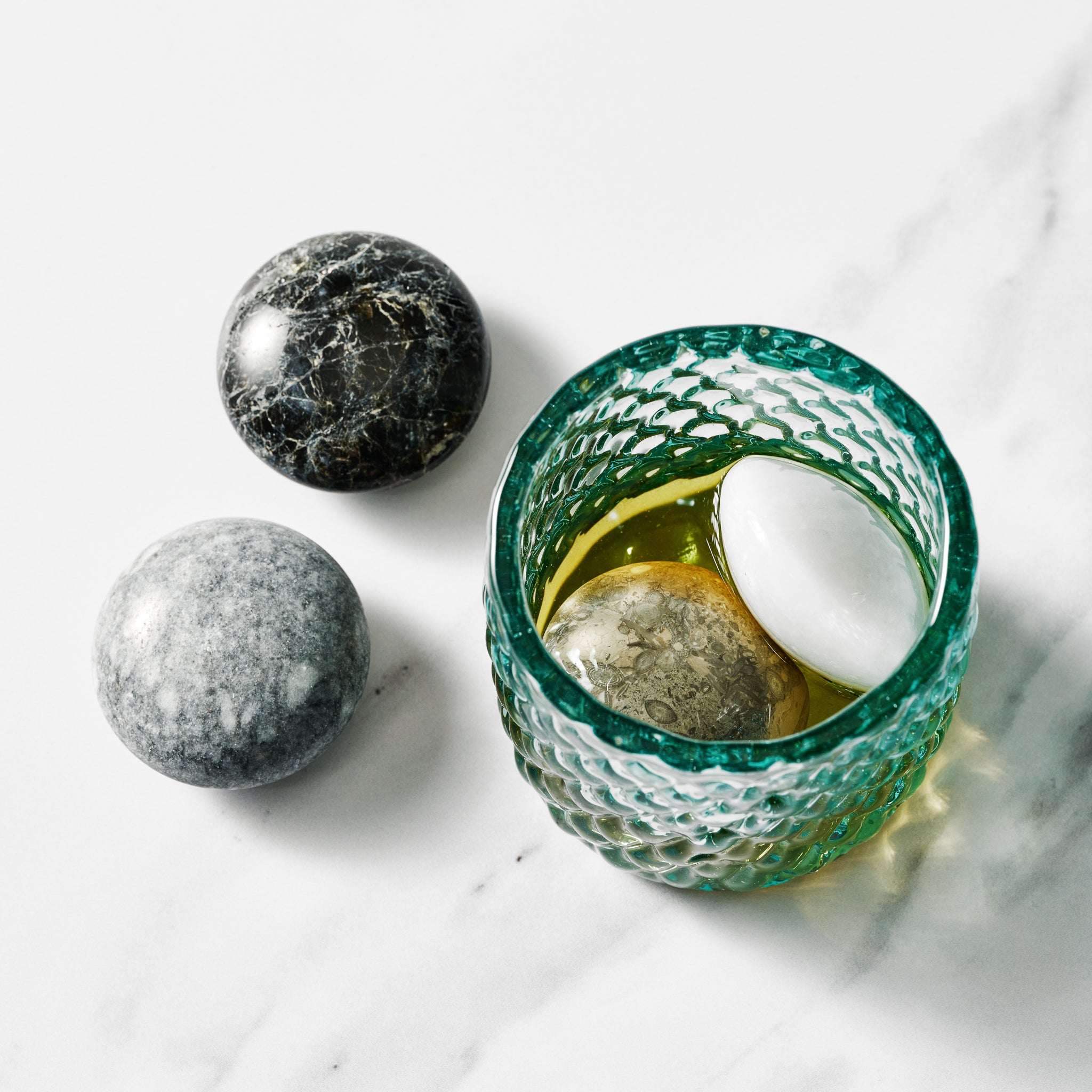 Close-up of reusable ice cubes for cocktails, showcasing their unique texture.