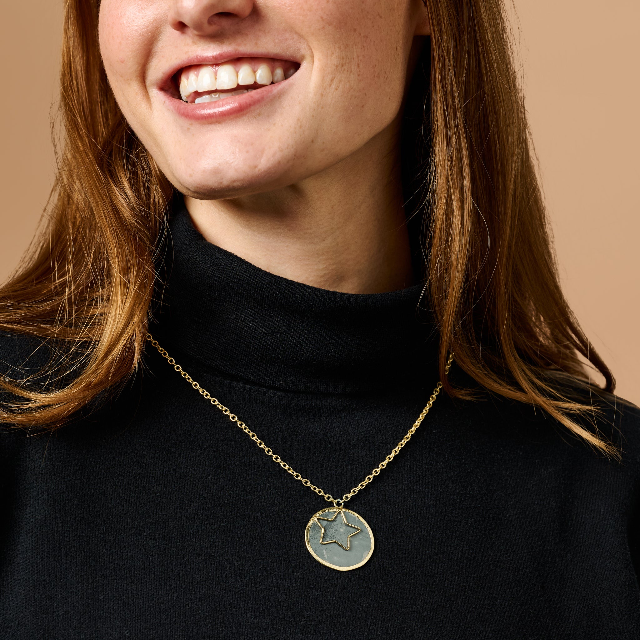Handcrafted celestial necklace featuring a capiz shell star pendant on a delicate chain
