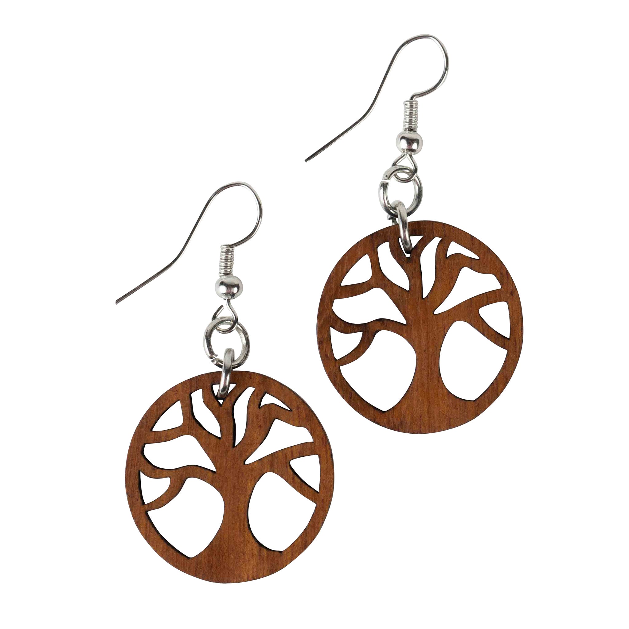 Model wearing eco-friendly wooden dangle earrings at an outdoor event, highlighting their lightweight design.