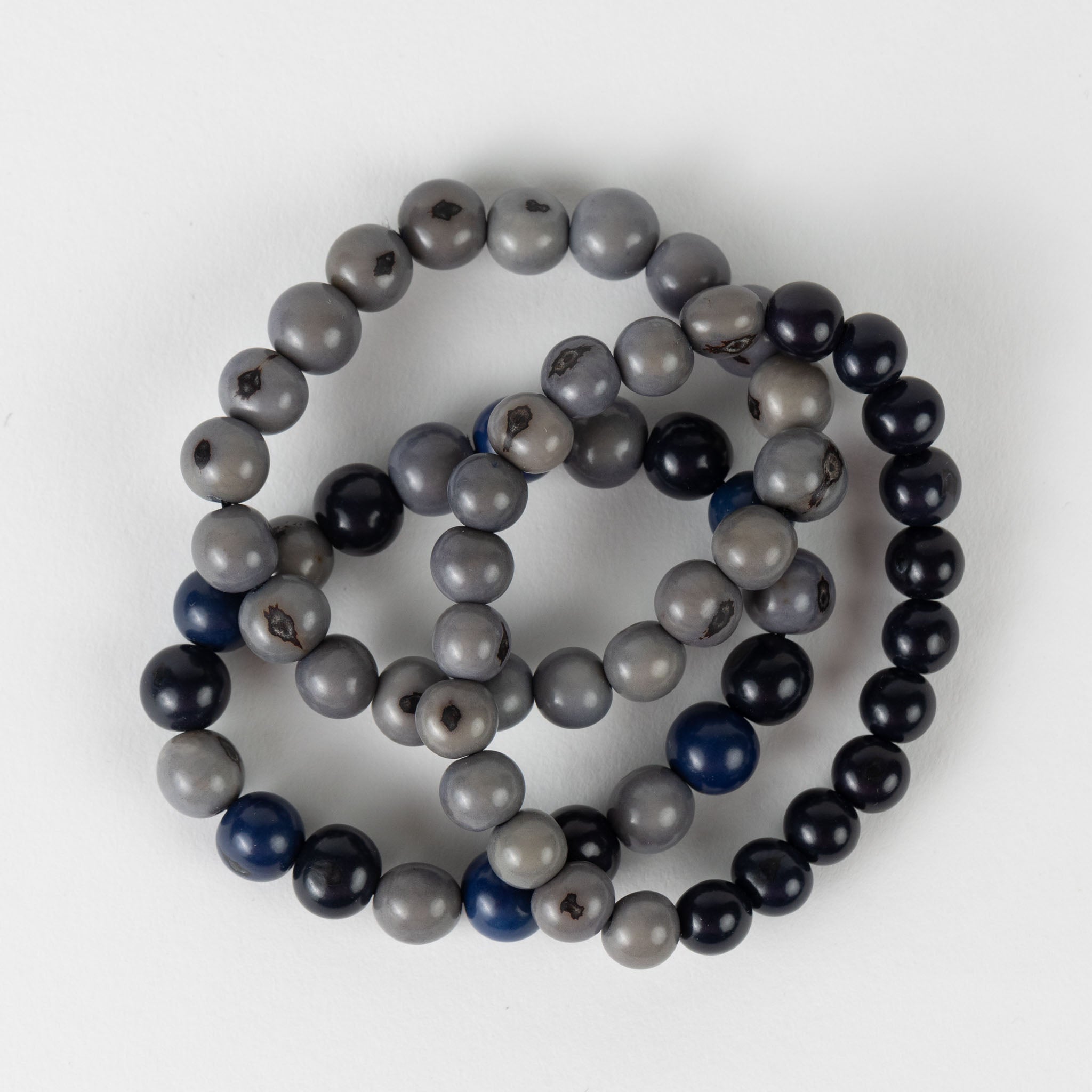 Close-up of the Courageous Spirit Bead Bracelets showcasing vibrant blue acai beads.