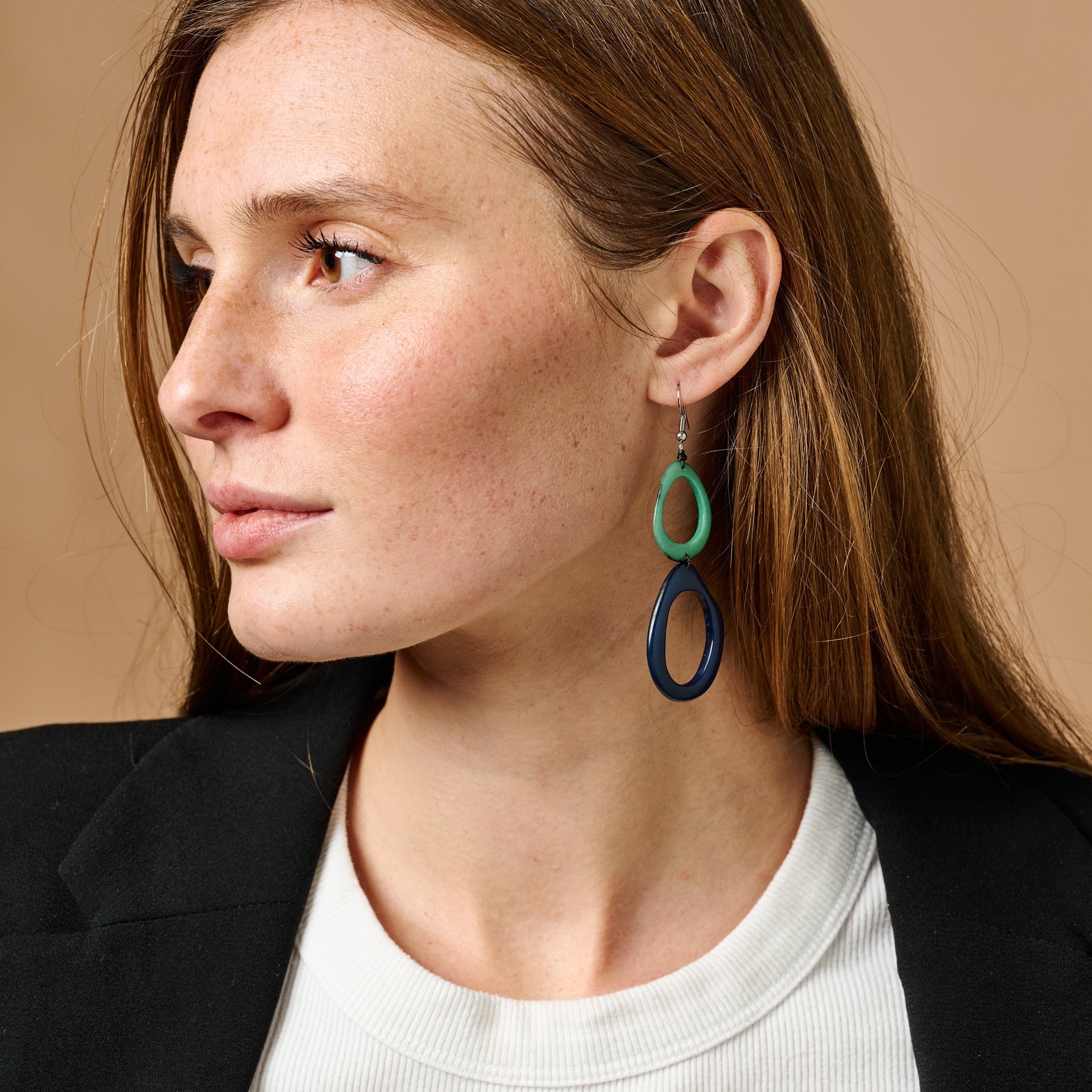 Close-up of Ocean Breeze Tagua Earrings showcasing blue and teal colors.