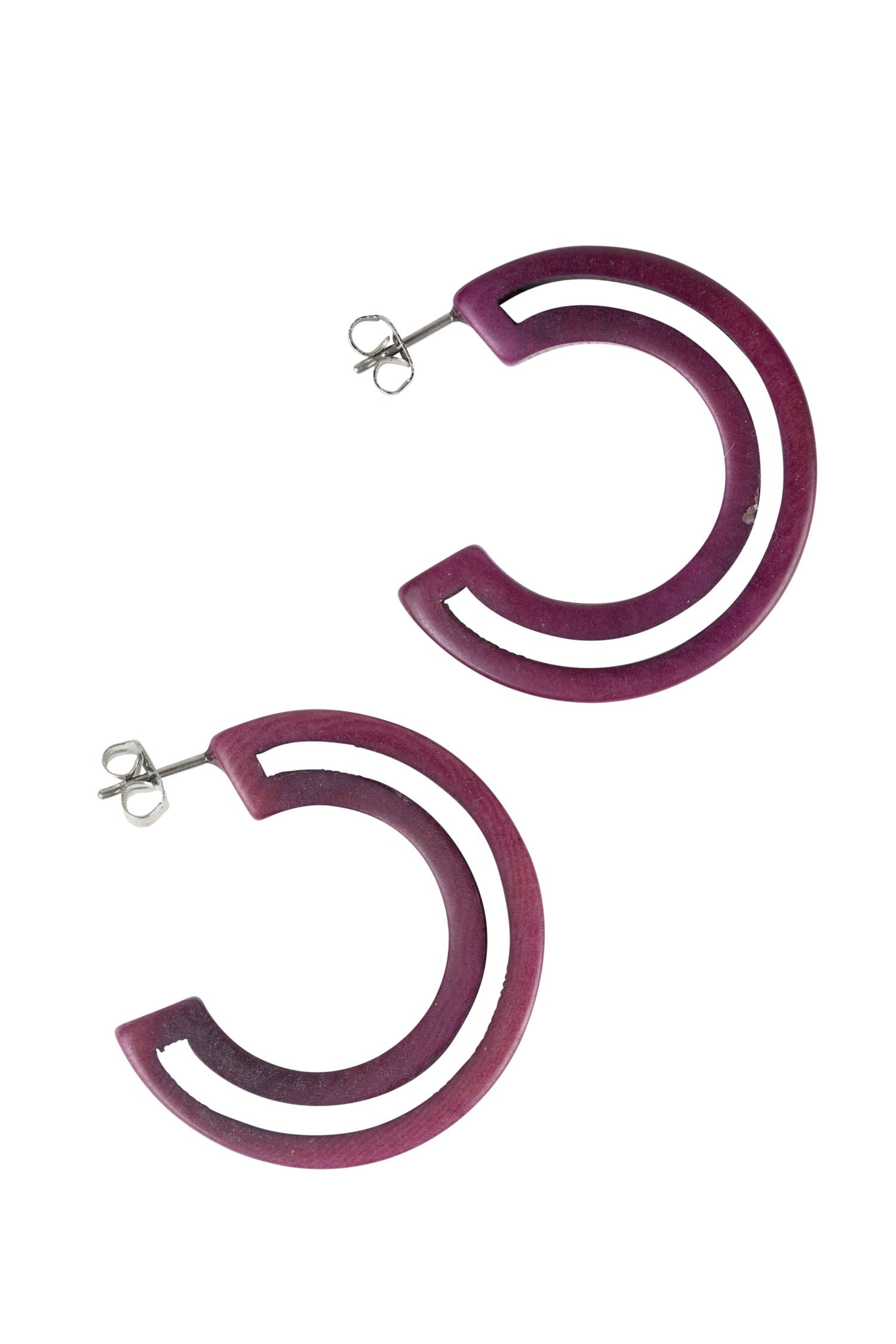 Model wearing handcrafted sustainable hoop earrings, highlighting their lightweight and stylish appearance.