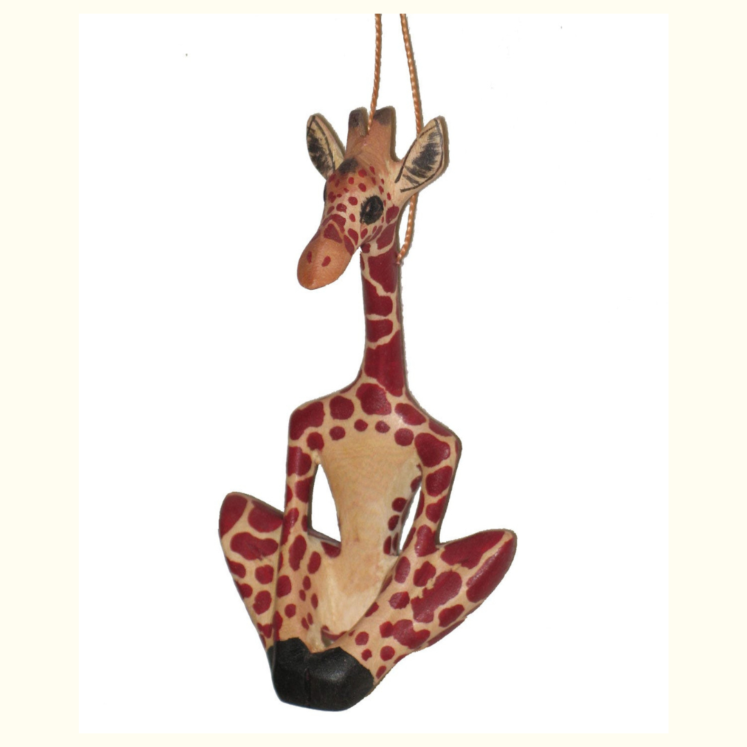 Cute giraffe tree ornament for sale displayed against a cozy background.