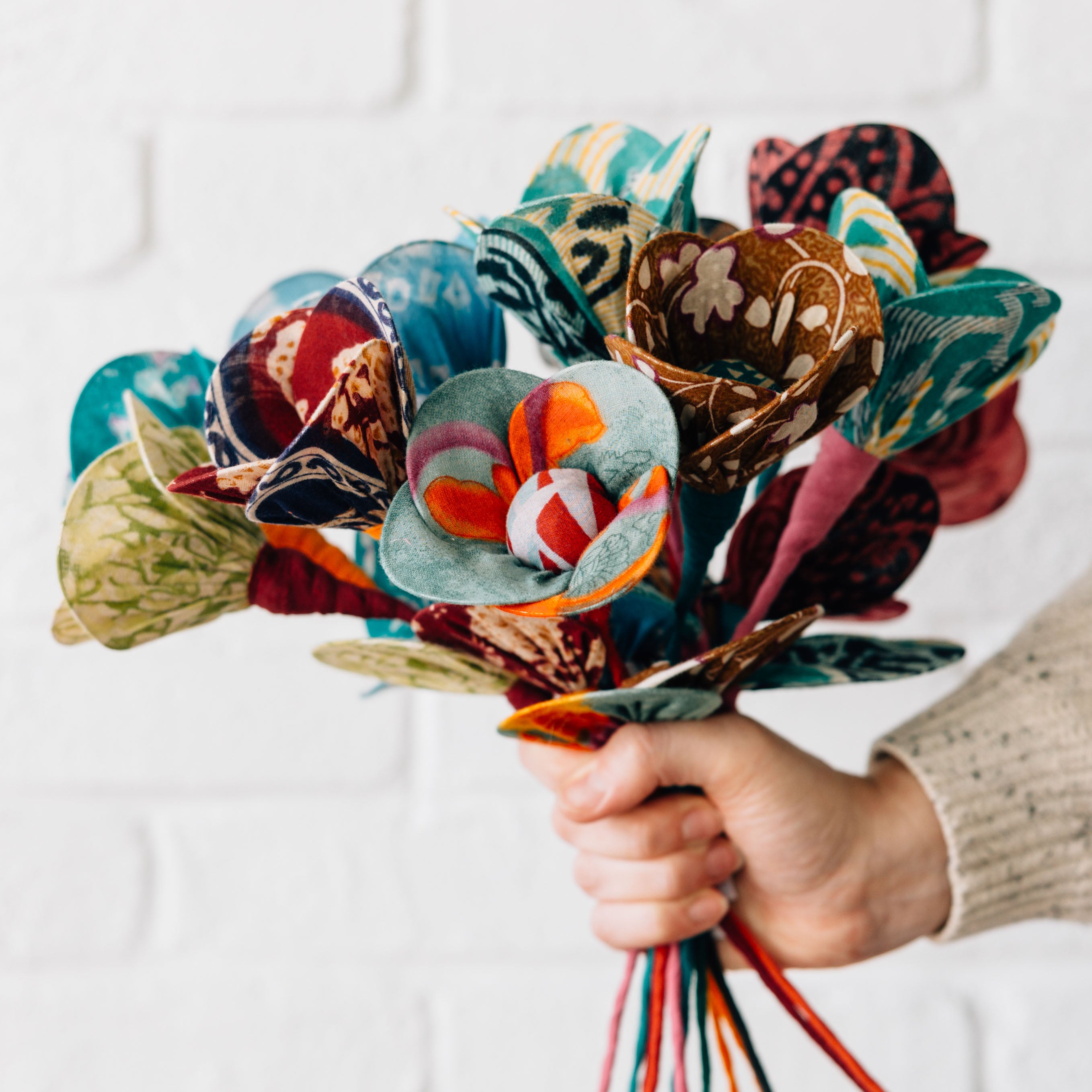 A unique sari flower bouquet displayed on a mantel, adding a pop of color to home decor.