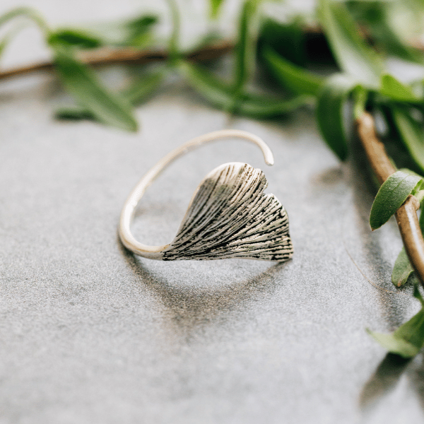 Artisan Ginkgo Leaf Ring viewed from the side, highlighting its adjustable feature.