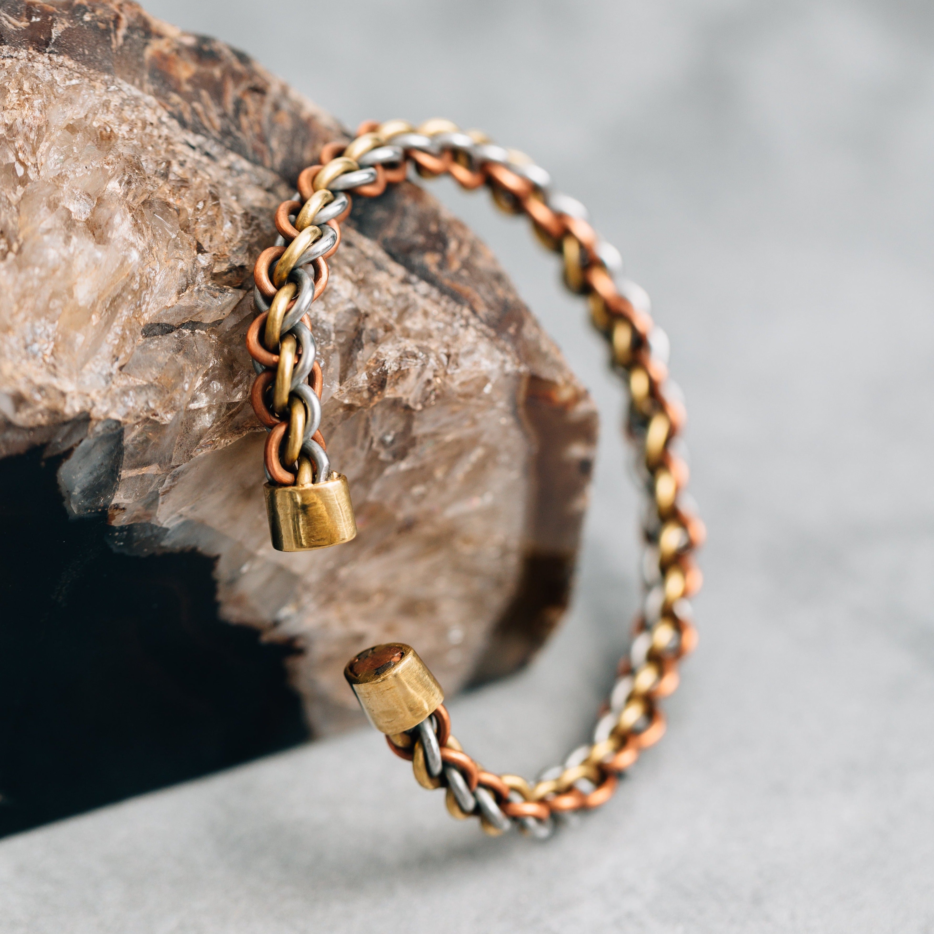 Elegant twisted copper cuff bracelet showcasing its unique craftsmanship and adjustable design.