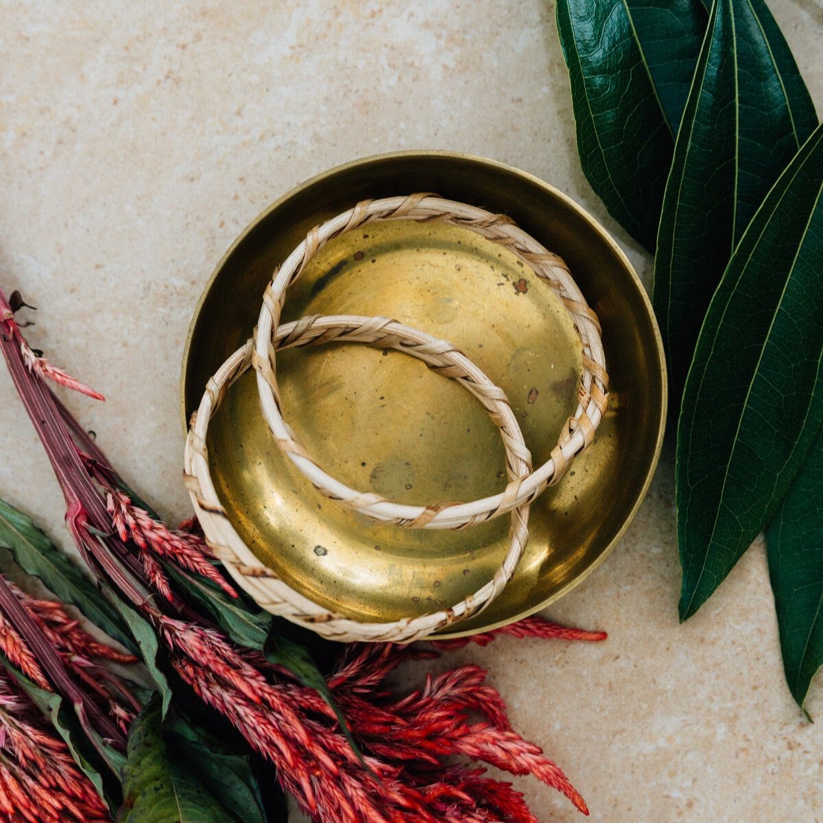 Artisan crafting bamboo bangles showcasing traditional weaving techniques.