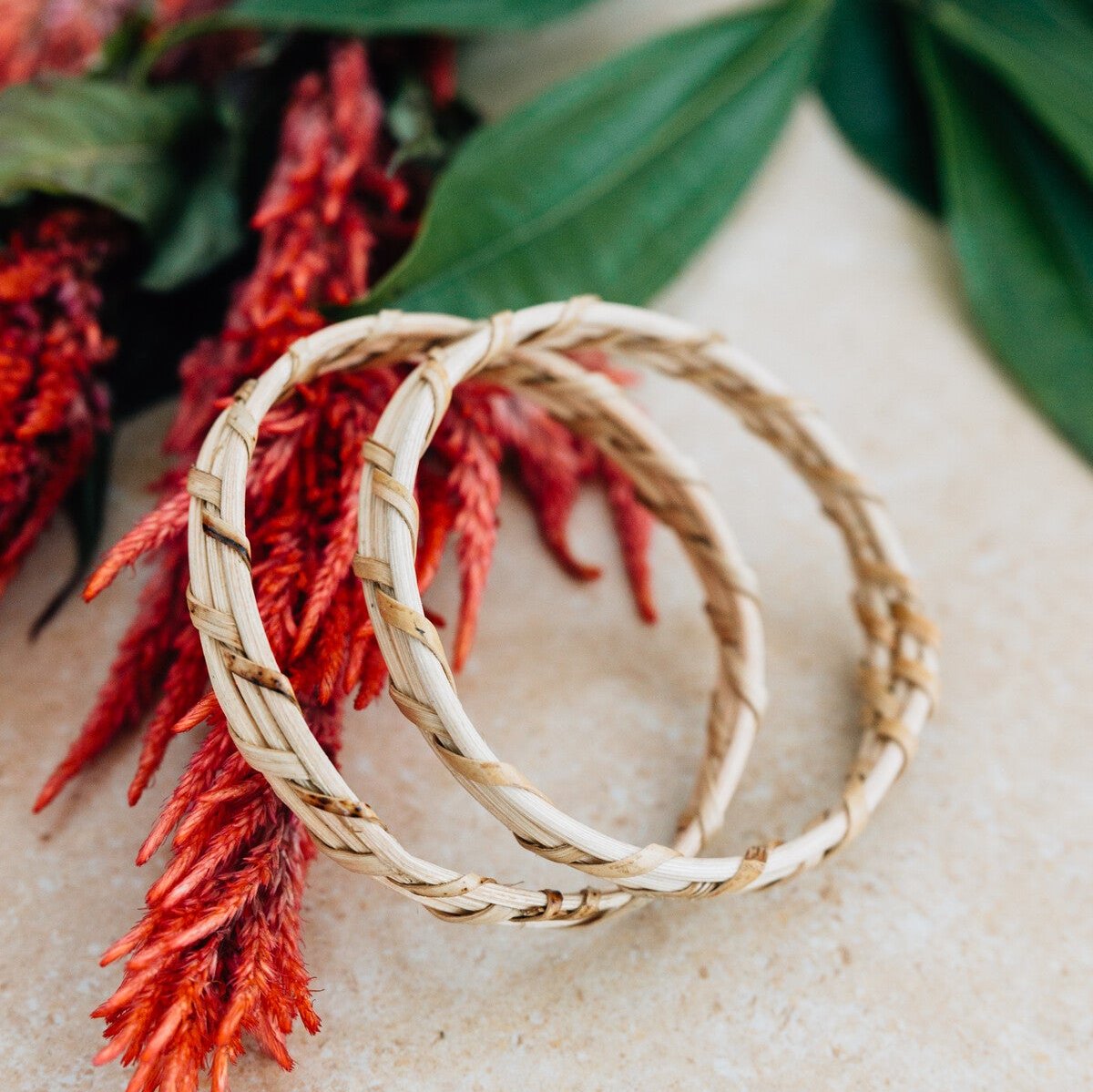 Close-up view of handcrafted bamboo bangles showing intricate weaving.