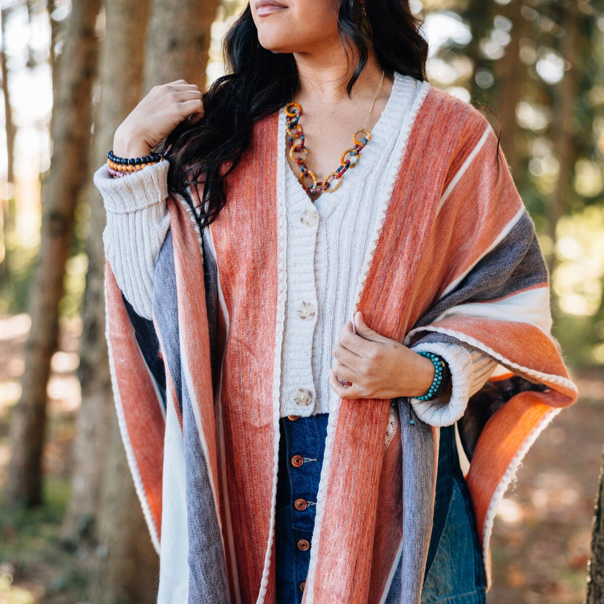 Model showcasing the artisan crafted boho poncho styled for a cool day.