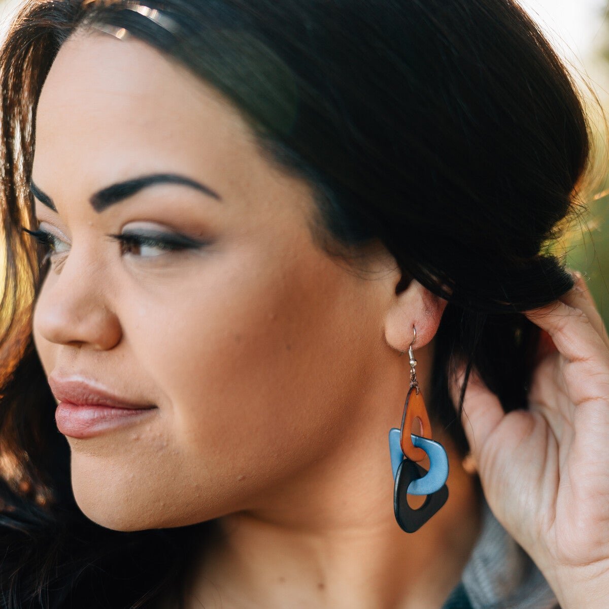 Side angle of Cascada tagua earrings showing their vibrant color combination and lightweight shape — perfect as eco-friendly jewelry.